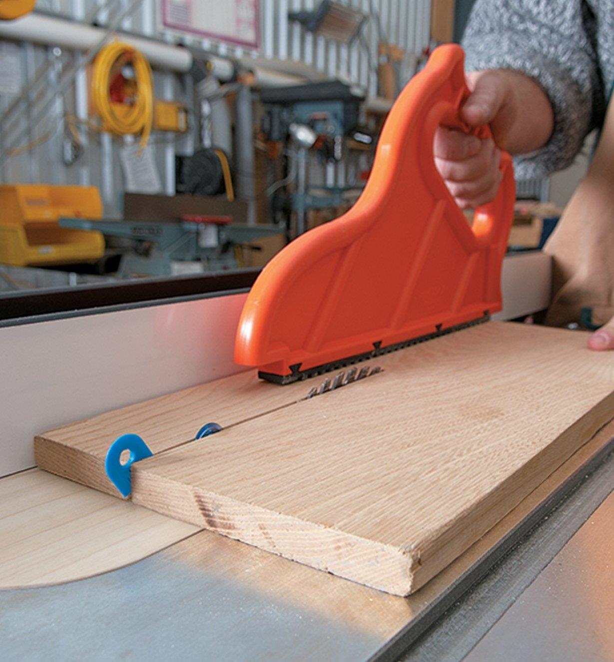 Cutting solid wood on a table saw with the kerf keeper slanted out of position
