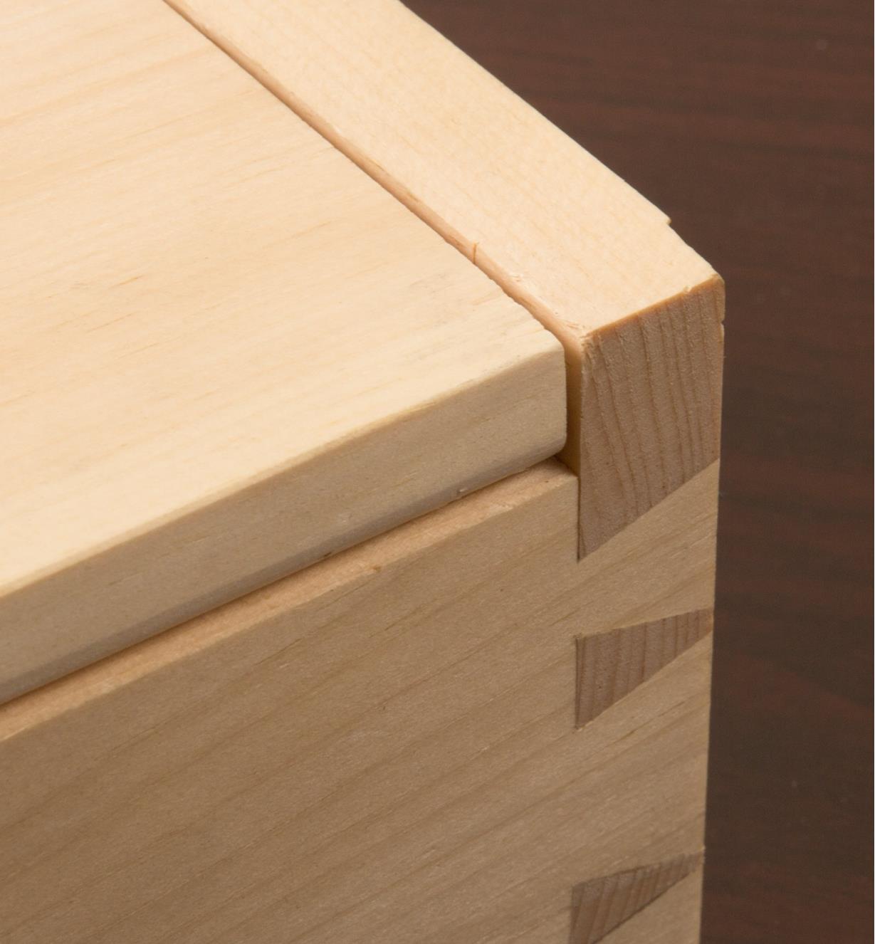 Close-up of corner of box lid with hidden hinge installed