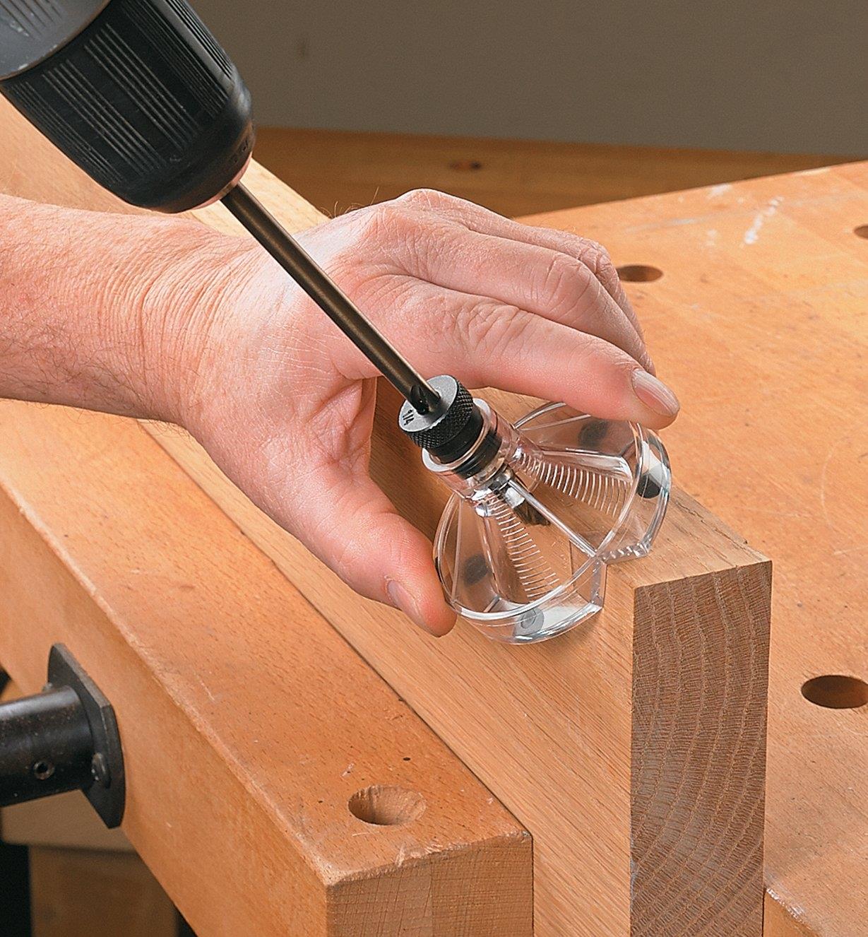 A Lee Valley drilling jig and extra-long drill bit used to drill into the corner of a piece of stock