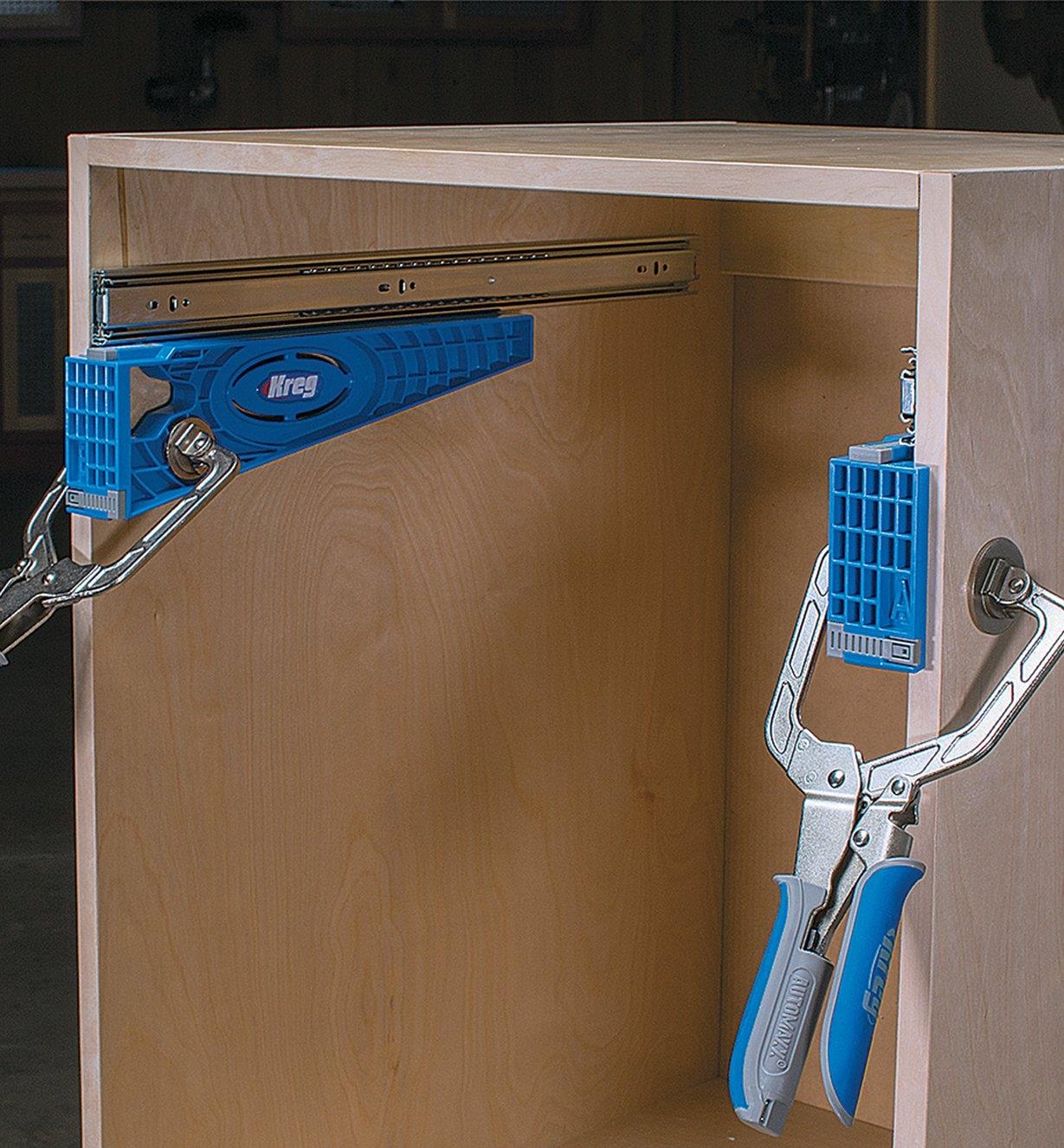 Using mounting brackets to install slides in a frameless cabinet