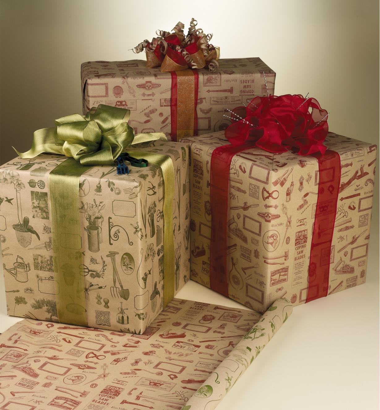 Three presents wrapped in Lee Valley Wrapping Paper with bows