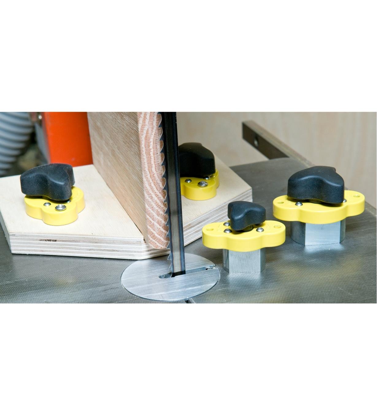 Magnetic clamps installed on a re-sawing jig on a bandsaw table