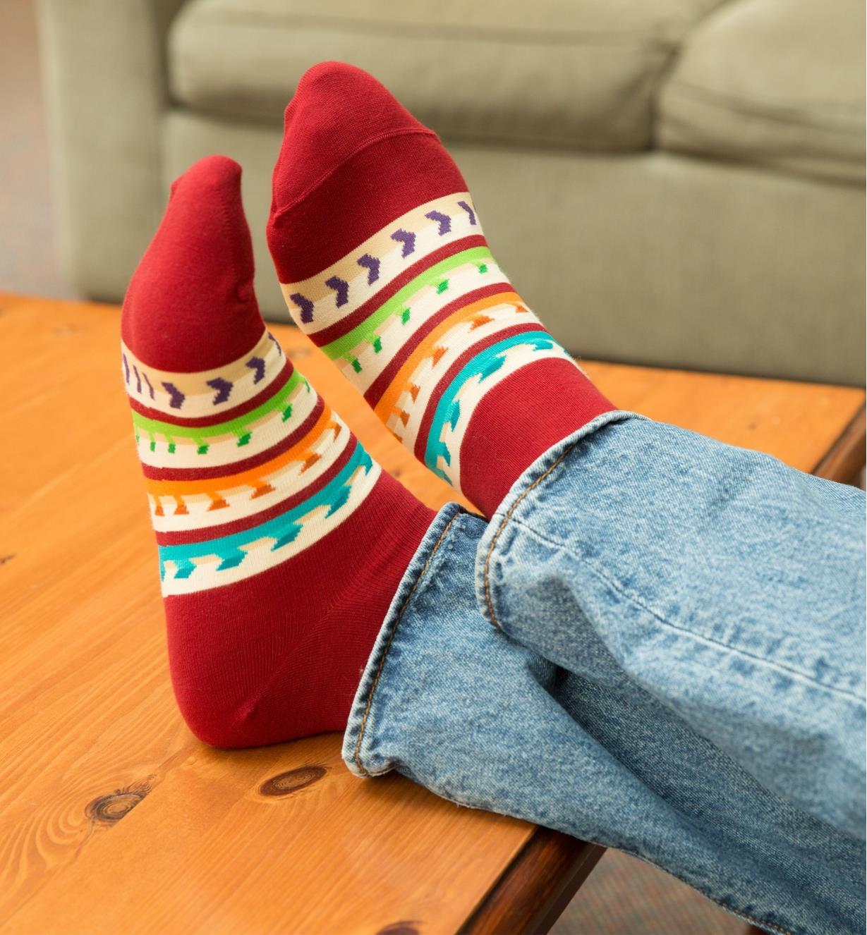 A person's feet clad in Lee Valley Woodworker's Socks propped on a coffee table