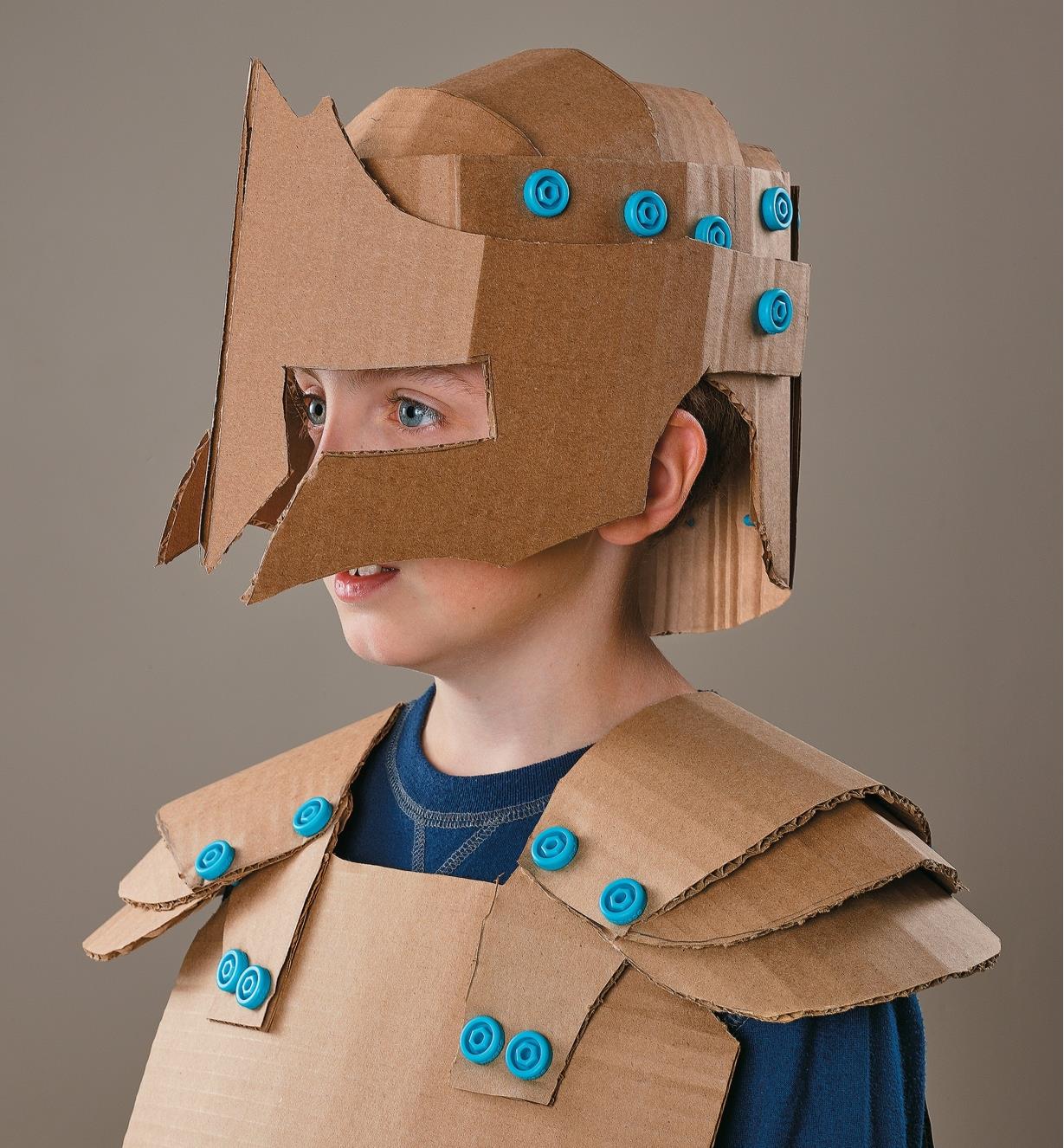 Child wearing a suit of armor made using the Makedo Cardboard-Building System