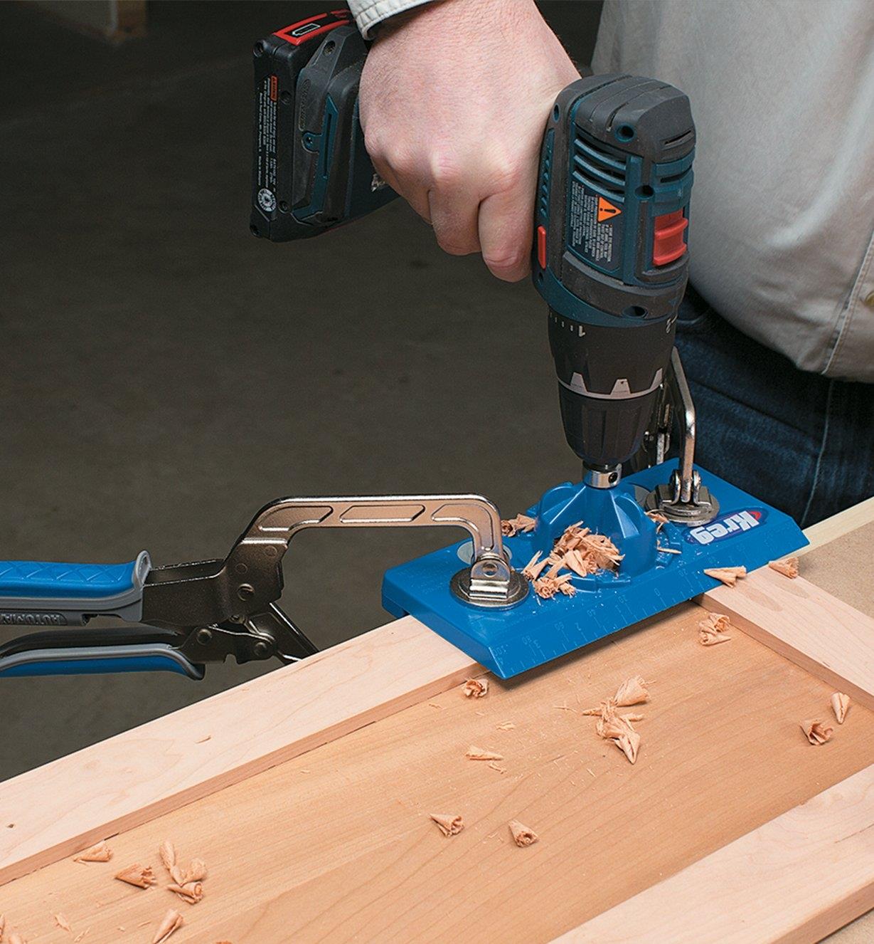 Using the Kreg European Hinge Jig to drill a hole in a door