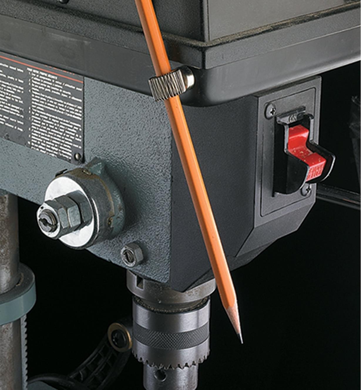 Magnet-Based Pen & Pencil Holders holding a pencil on a drill press