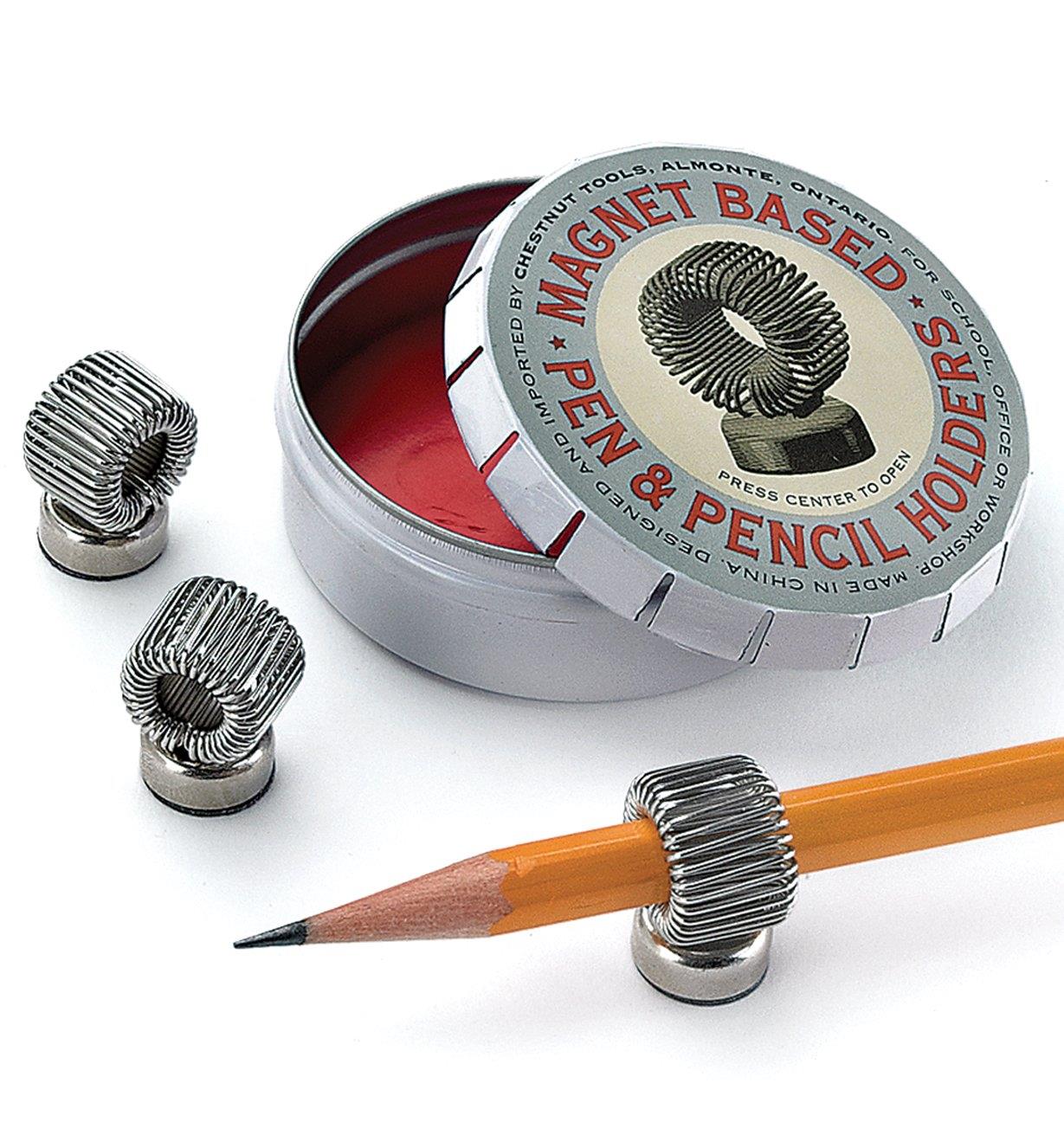 Magnet-Based Pen & Pencil Holders beside the tin, one of them holding a pencil