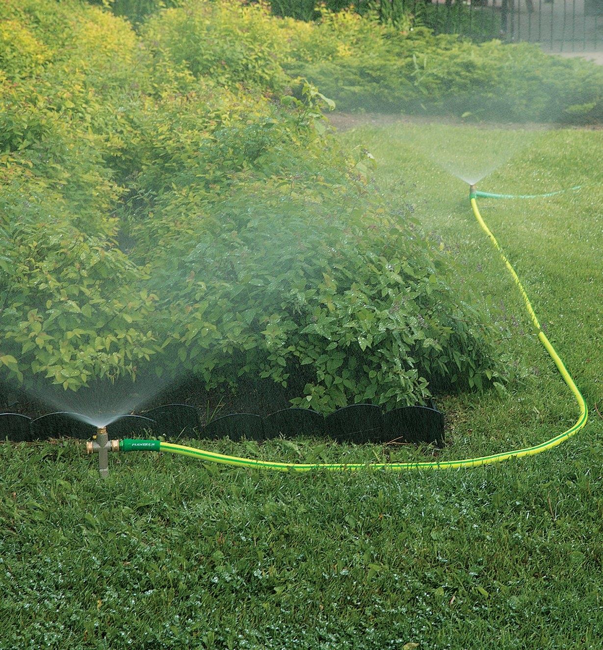Two In-Line Spot Sprinklers linked by a hose, watering a yard