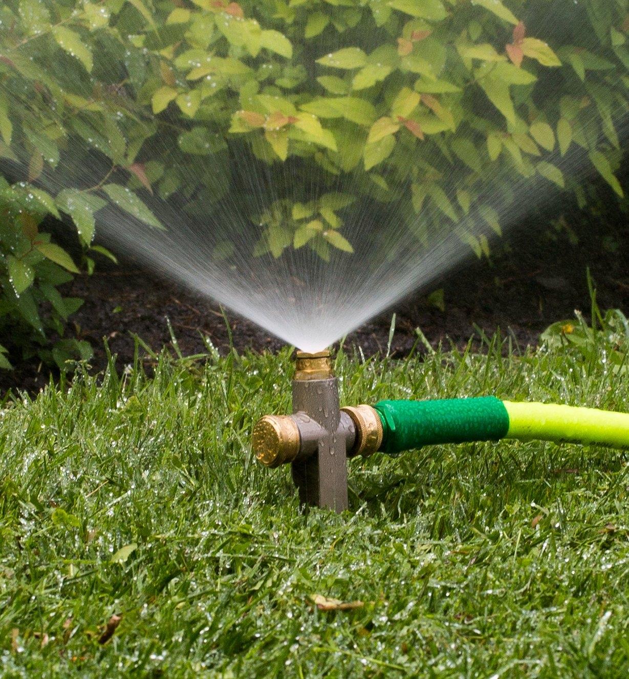 Close-up of In-Line Spot Sprinkler watering a yard