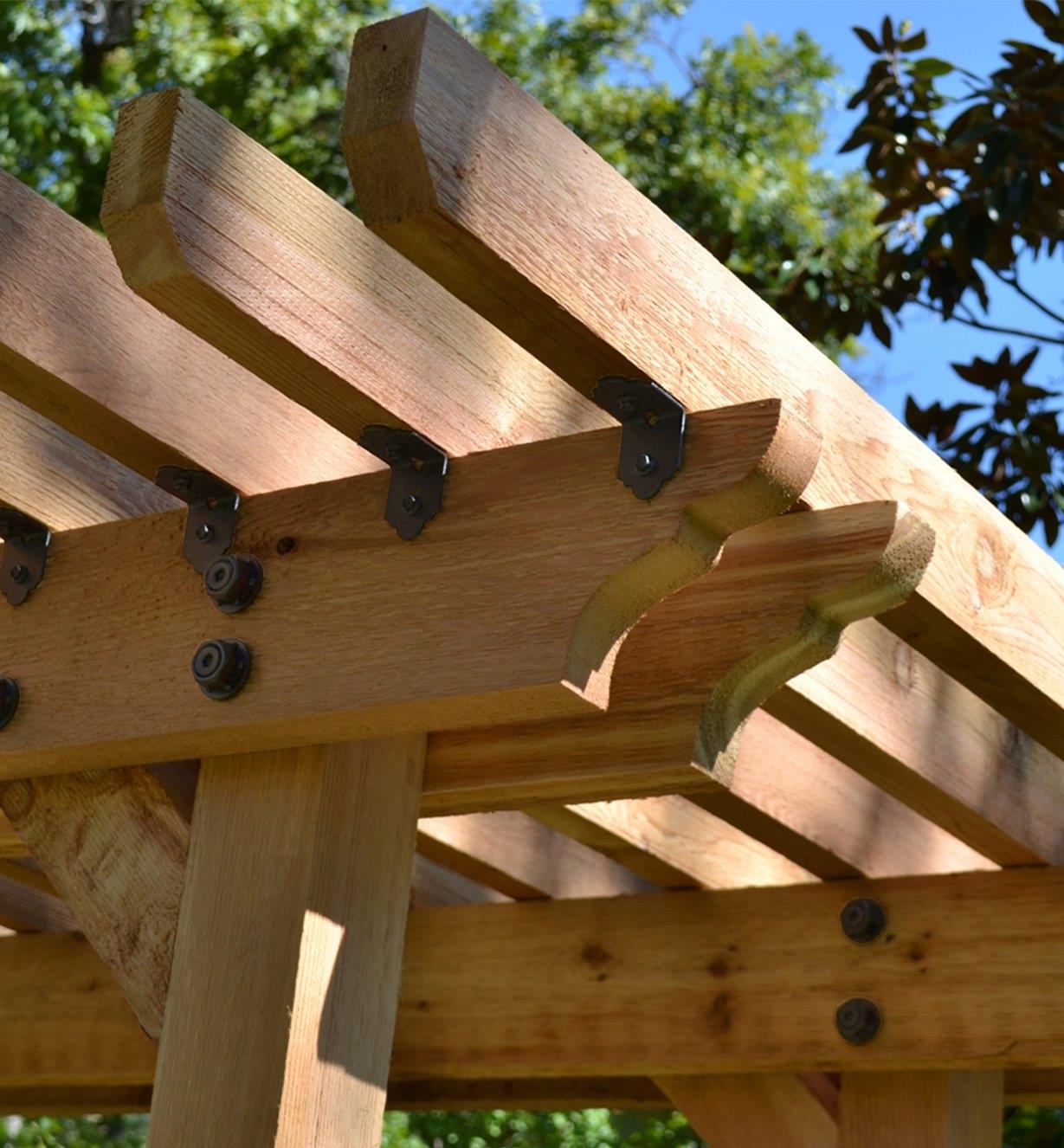 Ozco 2" Rafter Clips installed on a pergola