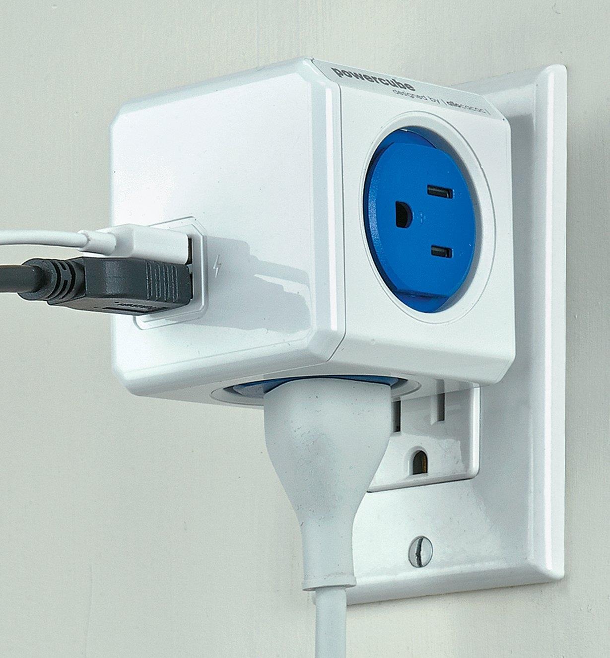 PowerCube with several cords plugged into it, plugged into a wall outlet