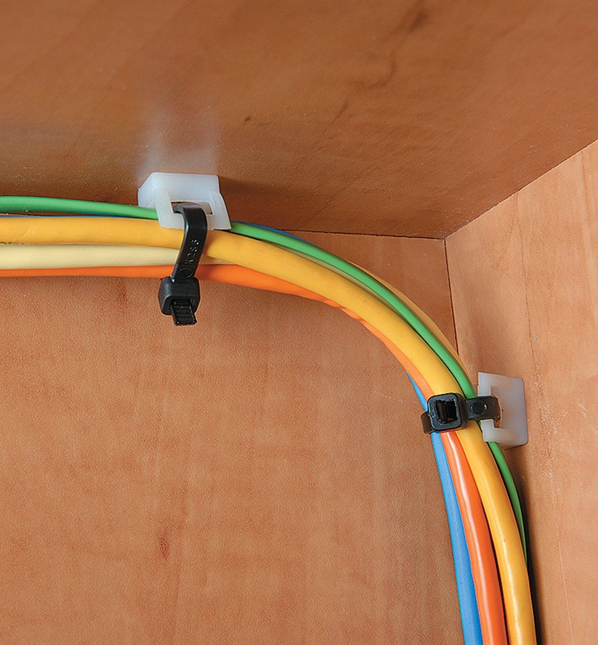 Y-Mount Saddle Cable Tie-Mounts used to attach cable ties to the inside of a cabinet