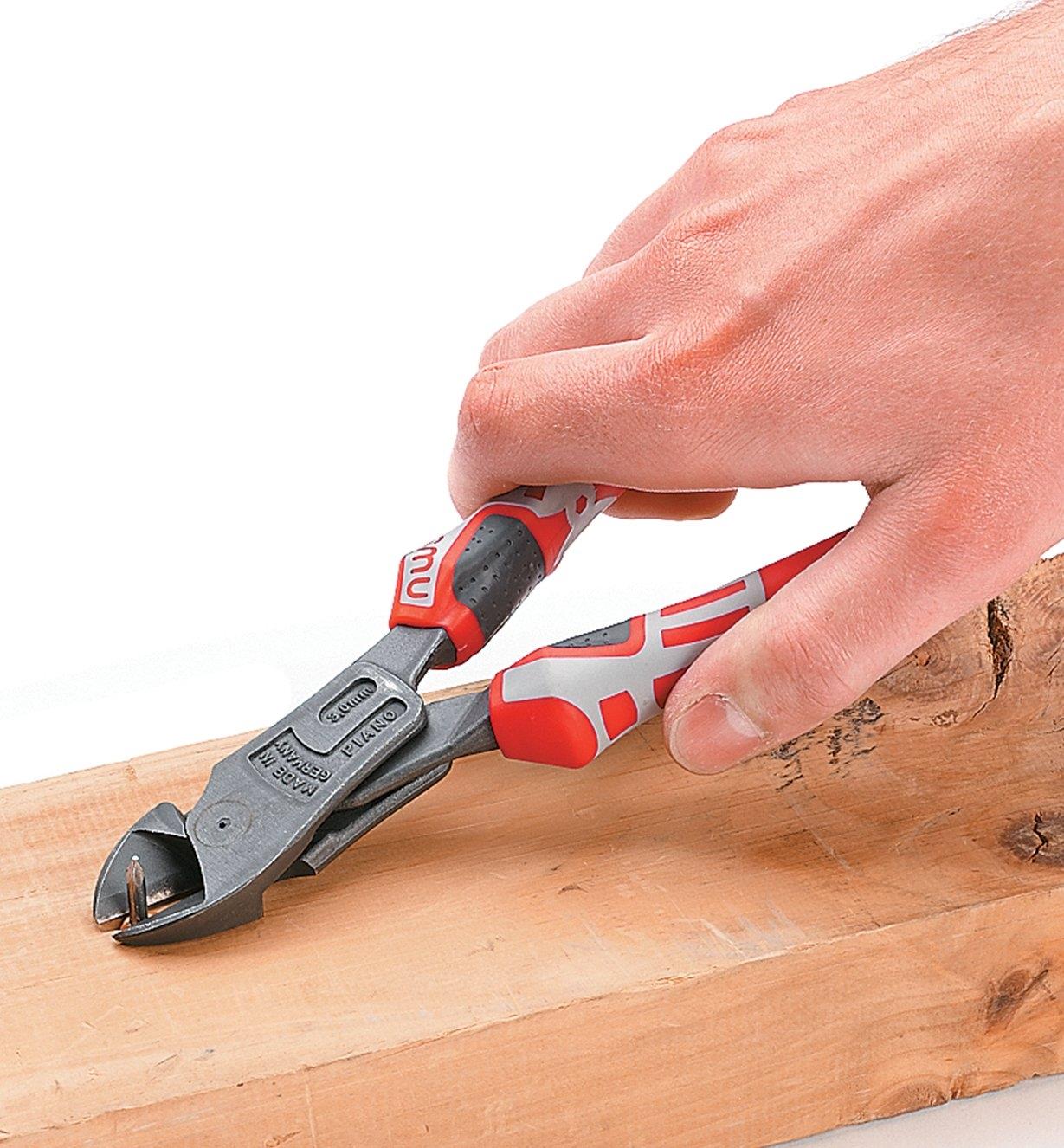 Using NWS Side-Cutters to clip off the end of a nail protruding from a board