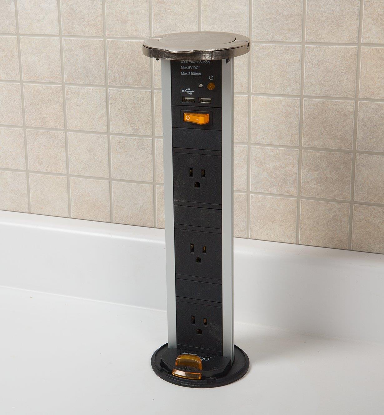 Fully open Pull-Out Power Bar installed in a countertop