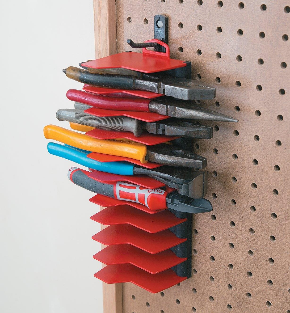 Various plyers held in a Pliers Organizer on a pegboard
