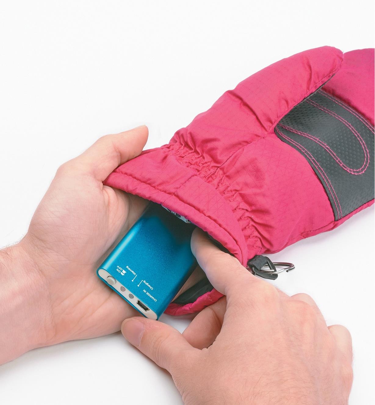 Placing the Rechargeable Handwarmer inside a mitten