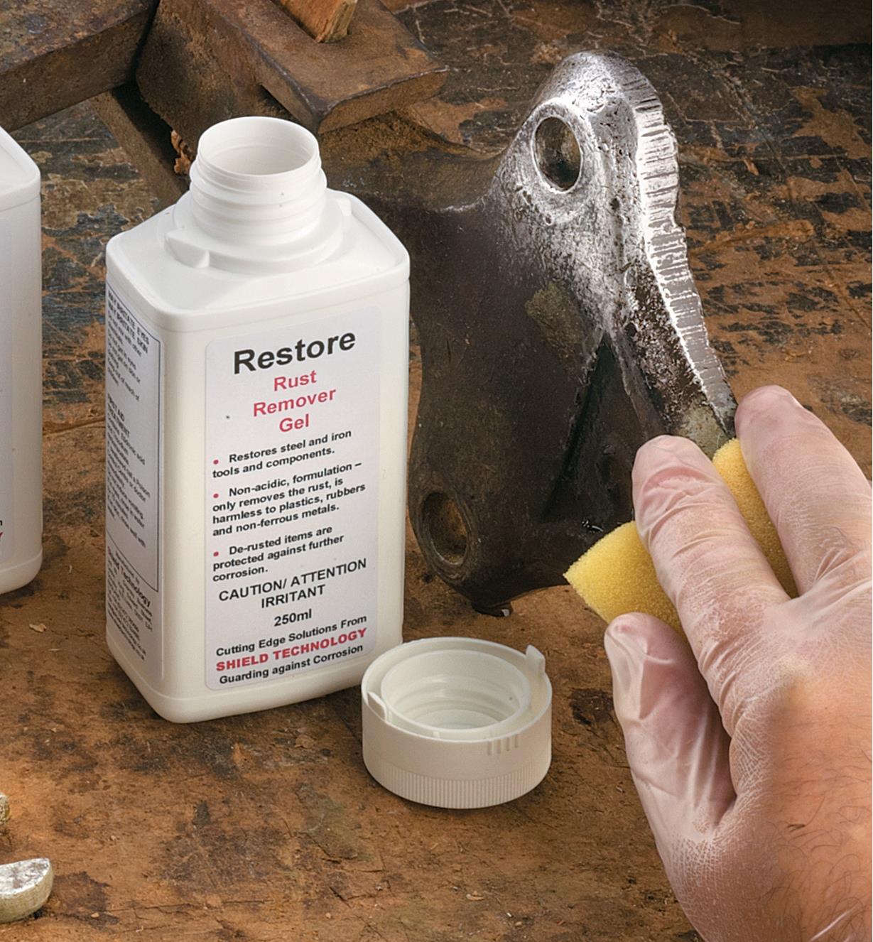 Wiping Rust Remover Gel on machinery