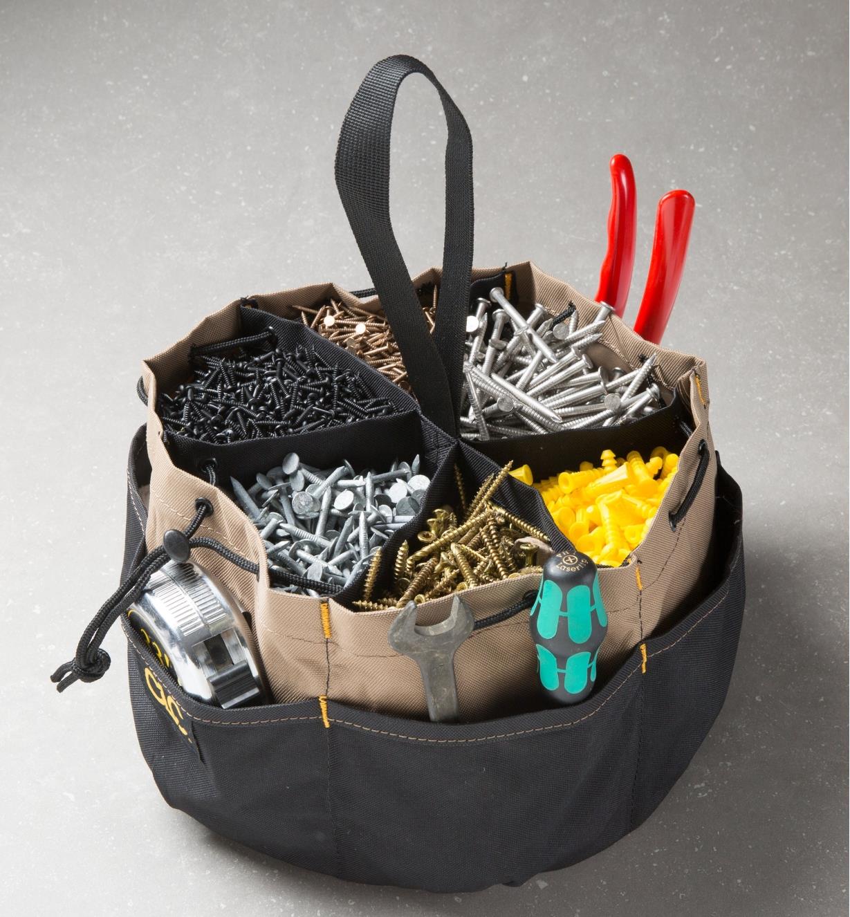 Drawstring Parts Organizer filled with fasteners and hand tools