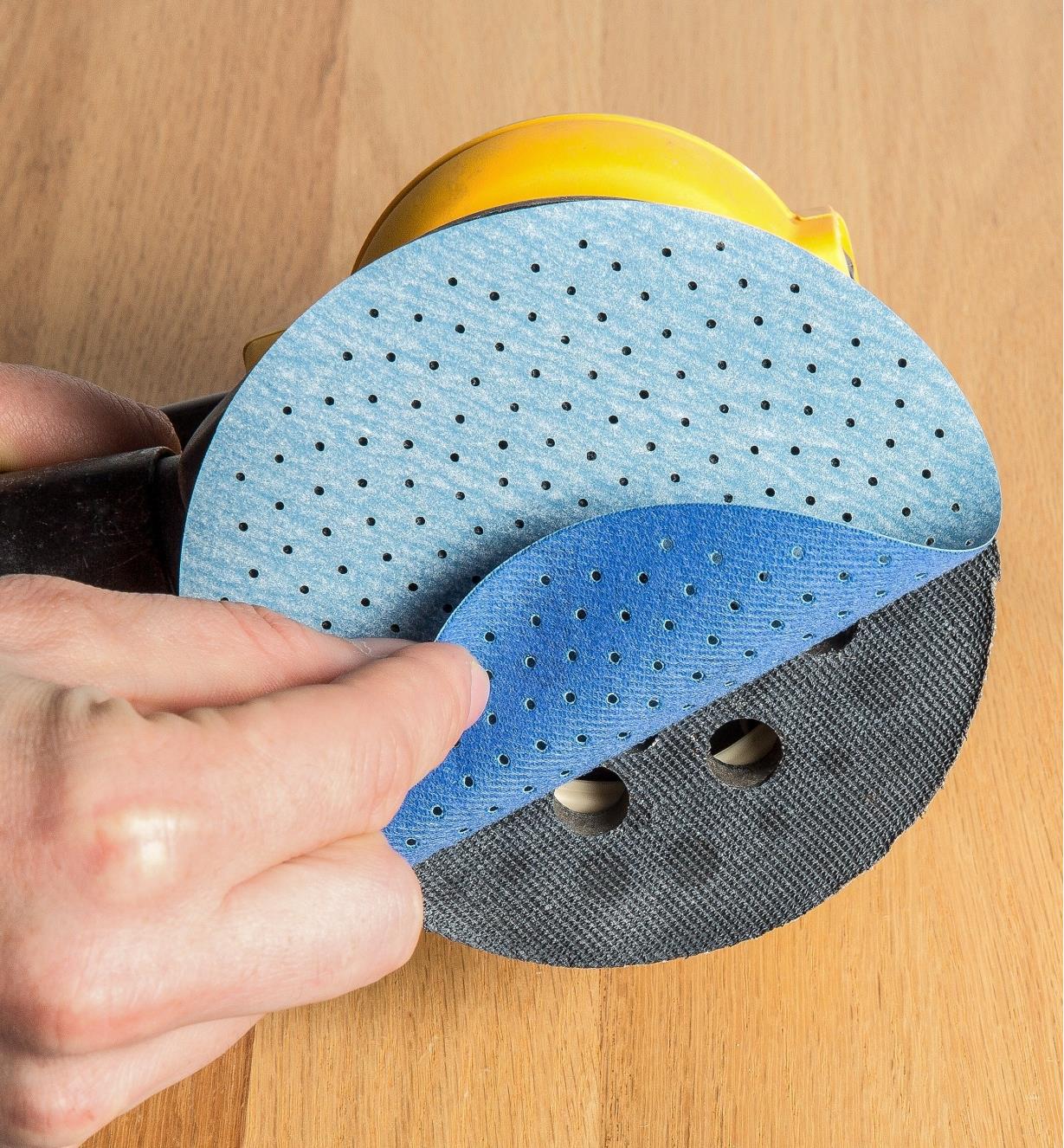 Attaching a disc to an electric sander