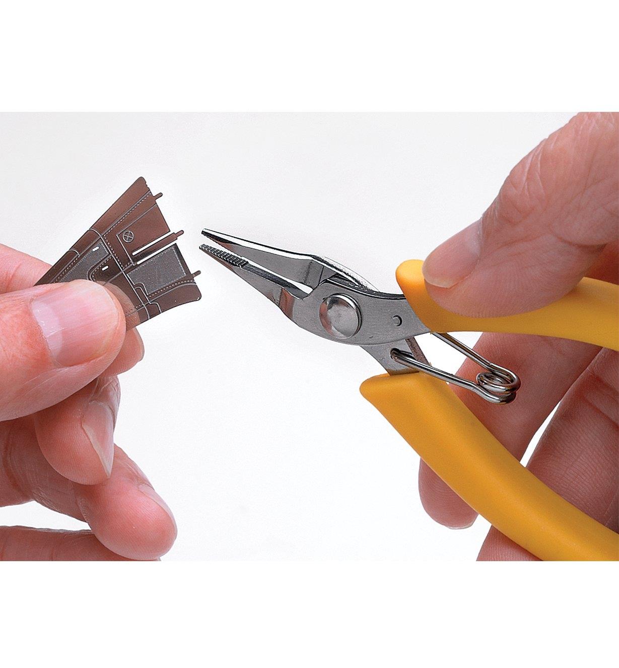 Using Mini Pliers to put together a metal model