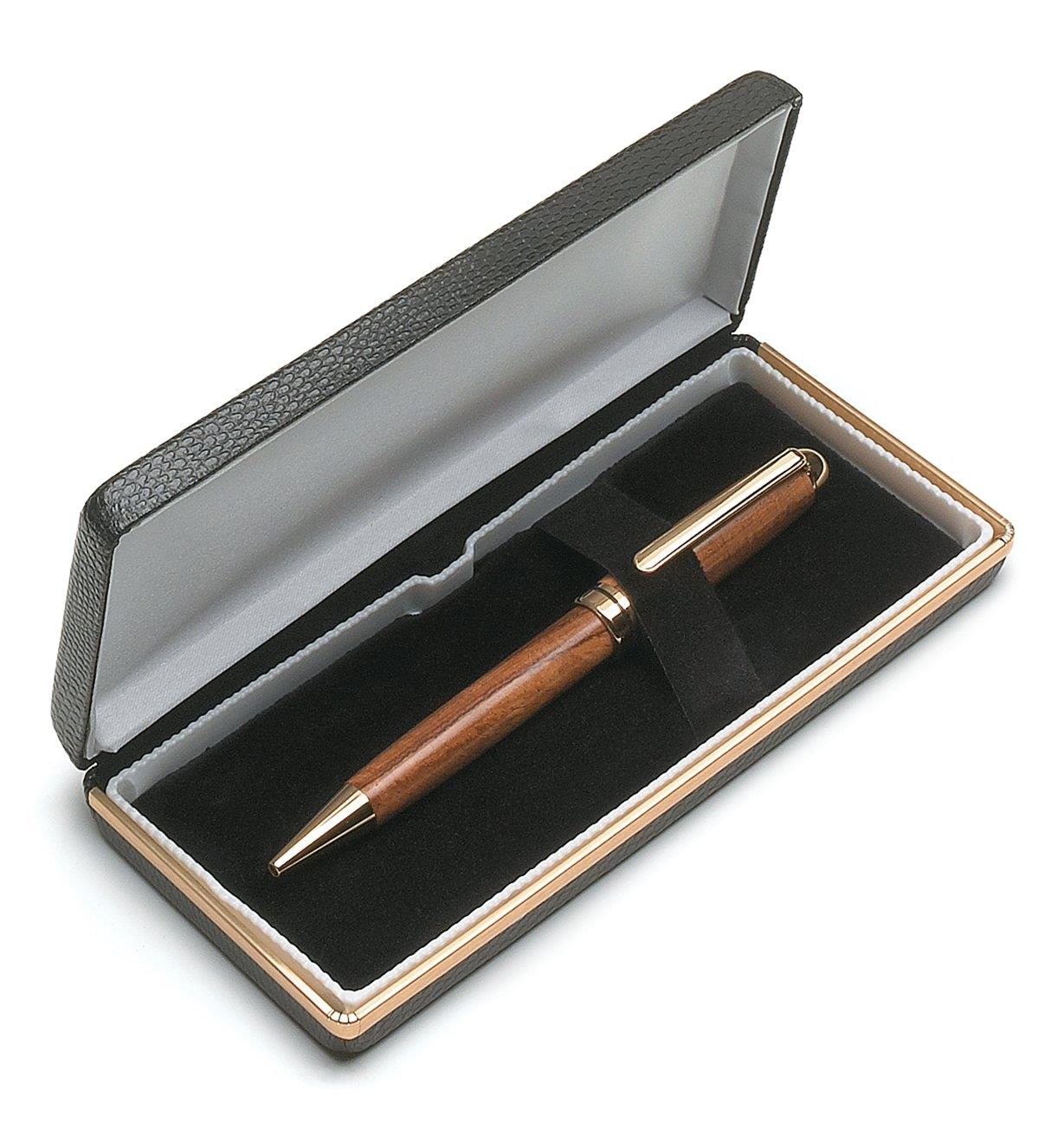 Leatherette case holding a wooden pen