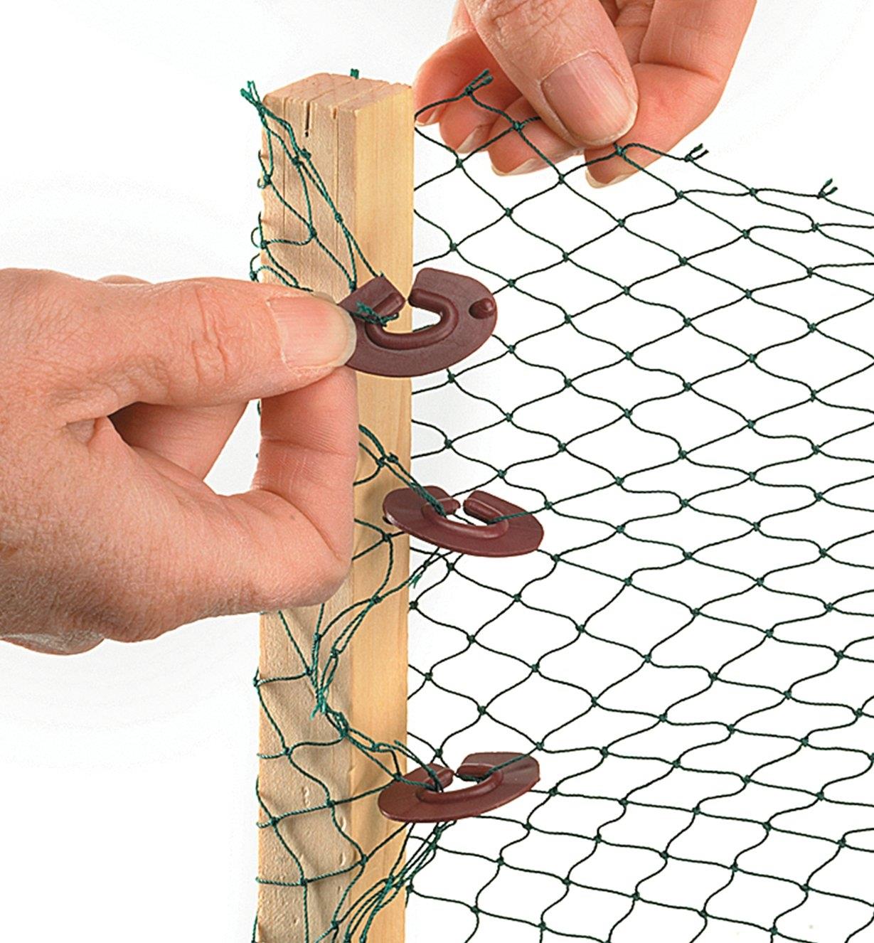 Using Net-to-Net Clips to attach netting to a wooden stake