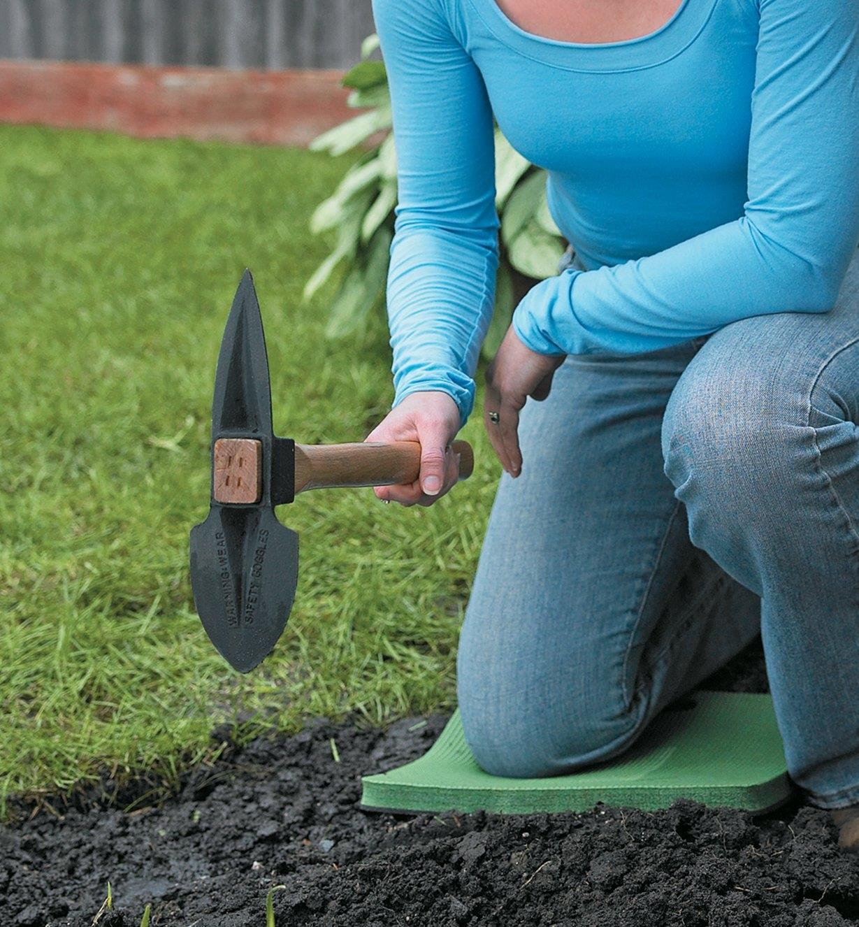 Using a Mini Planter to dig in garden soil