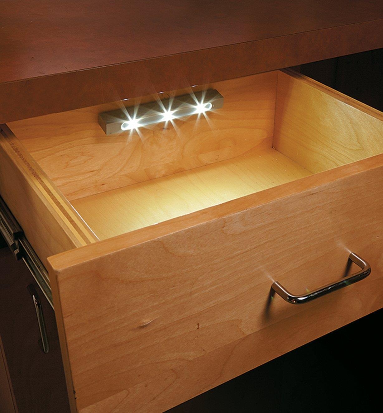 Example of drawer light mounted to the inside back of a desk drawer 