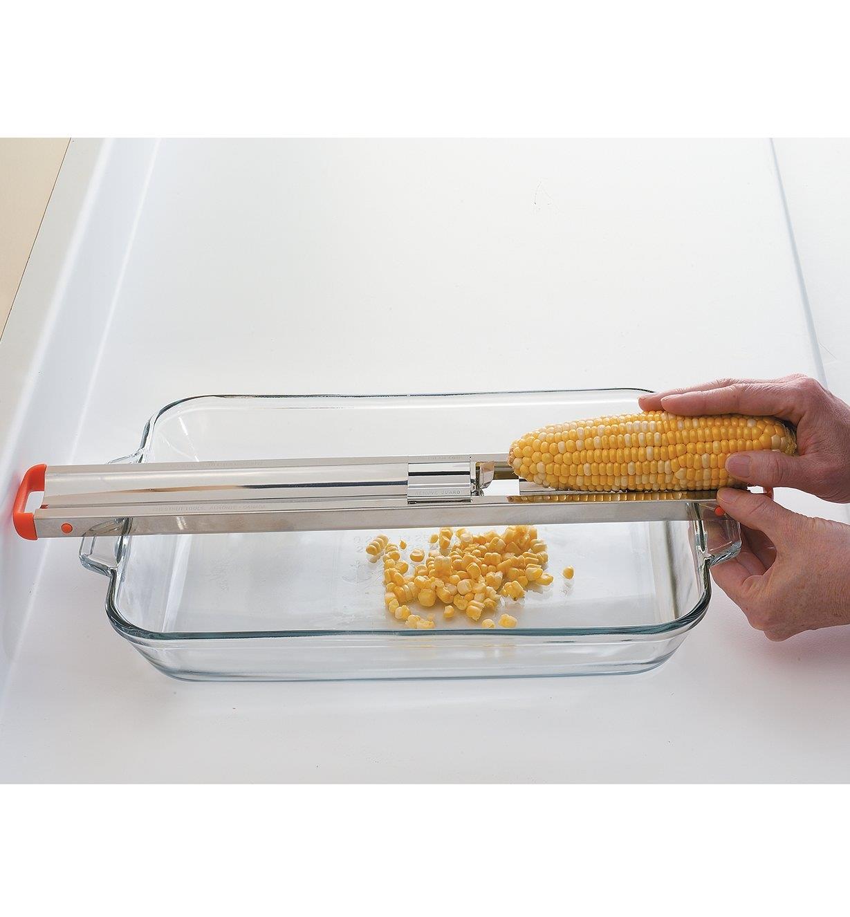 Using the Corn Cutter to remove whole kernels from a corn cob