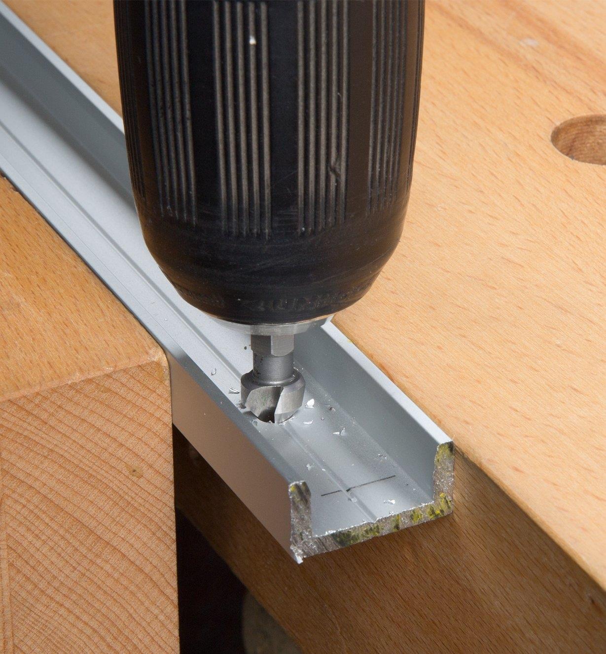 Drilling into a miter slot extrusion