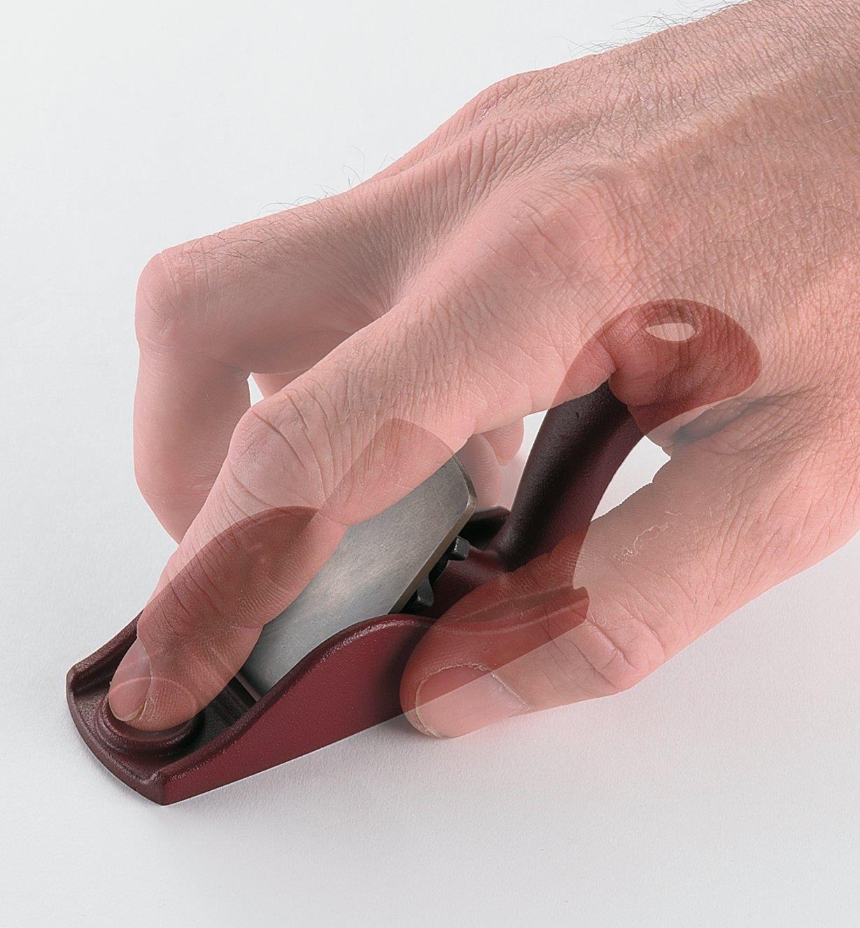 Ghosted image of a person's grip on a flat palm plane 