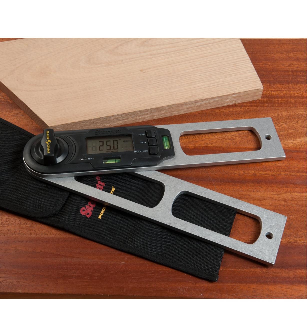 Starrett Digital Protractor lying on a table next to a piece of wood