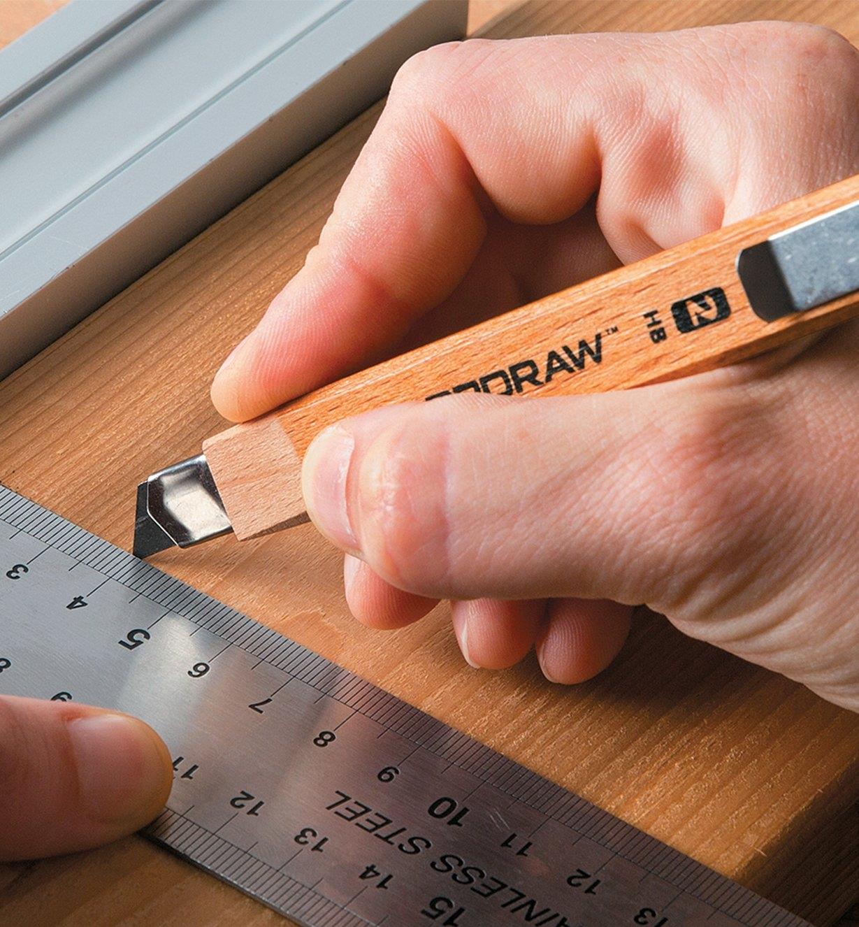 Marking a line on lumber using a ruler and SharpDraw Pencil