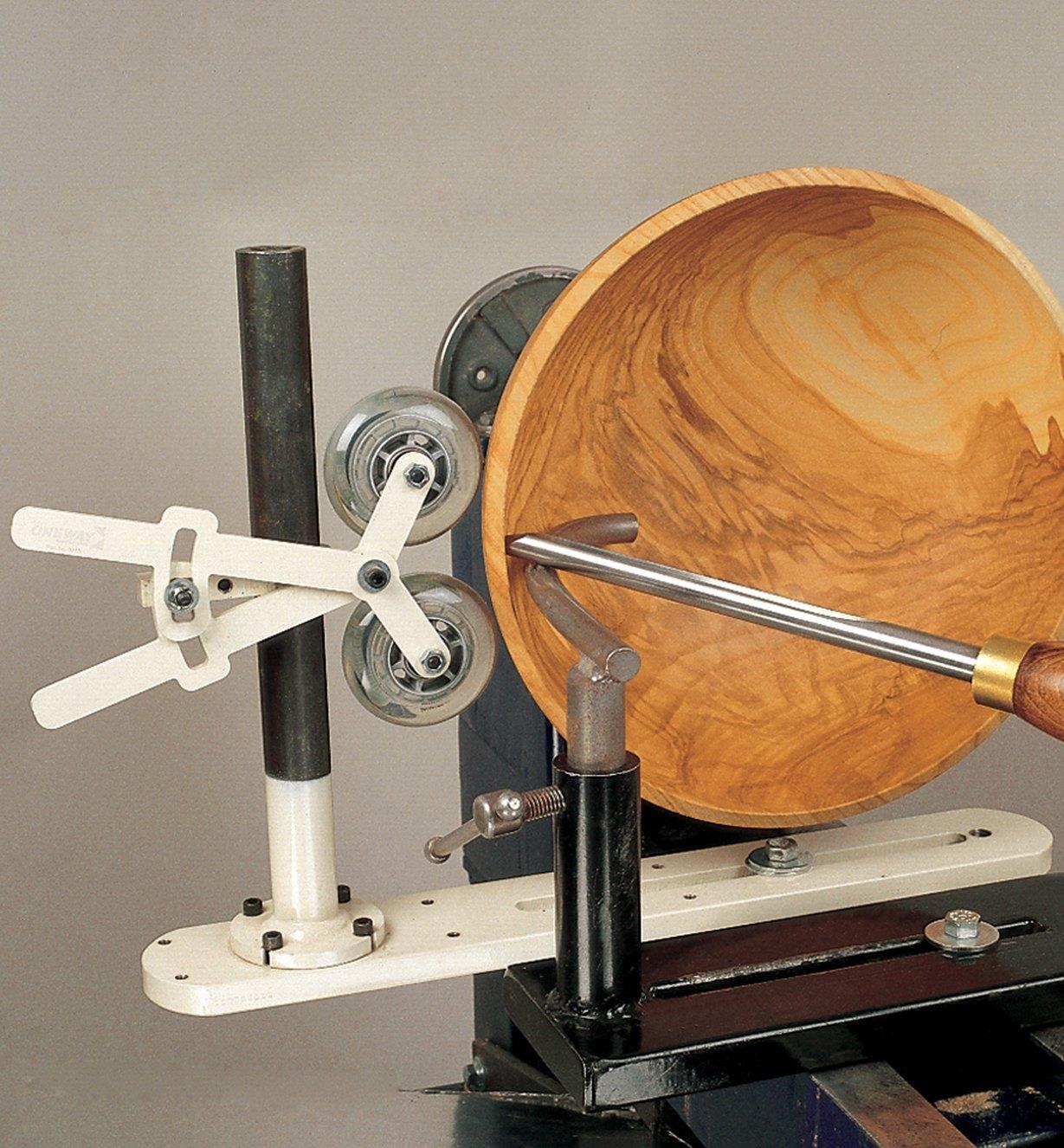Bowl Steady positioned against a bowl on a lathe