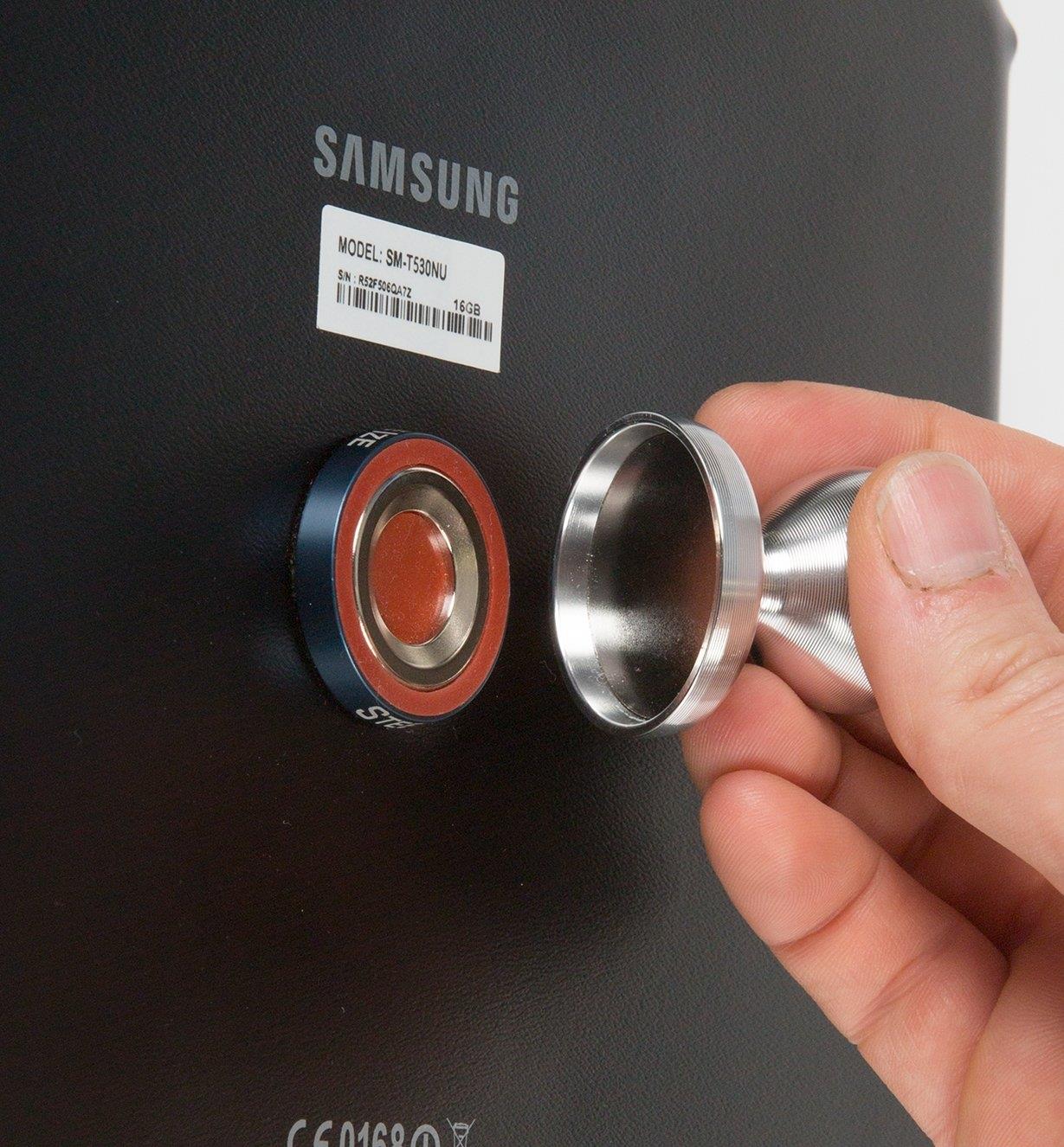 Attaching the HobKnob to a magnetic disc on the back of a tablet