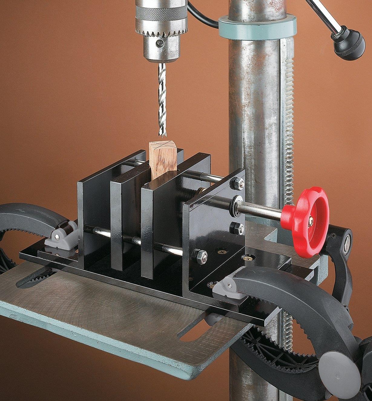 Vise clamped to a drill press in preparation for drilling a pen blank