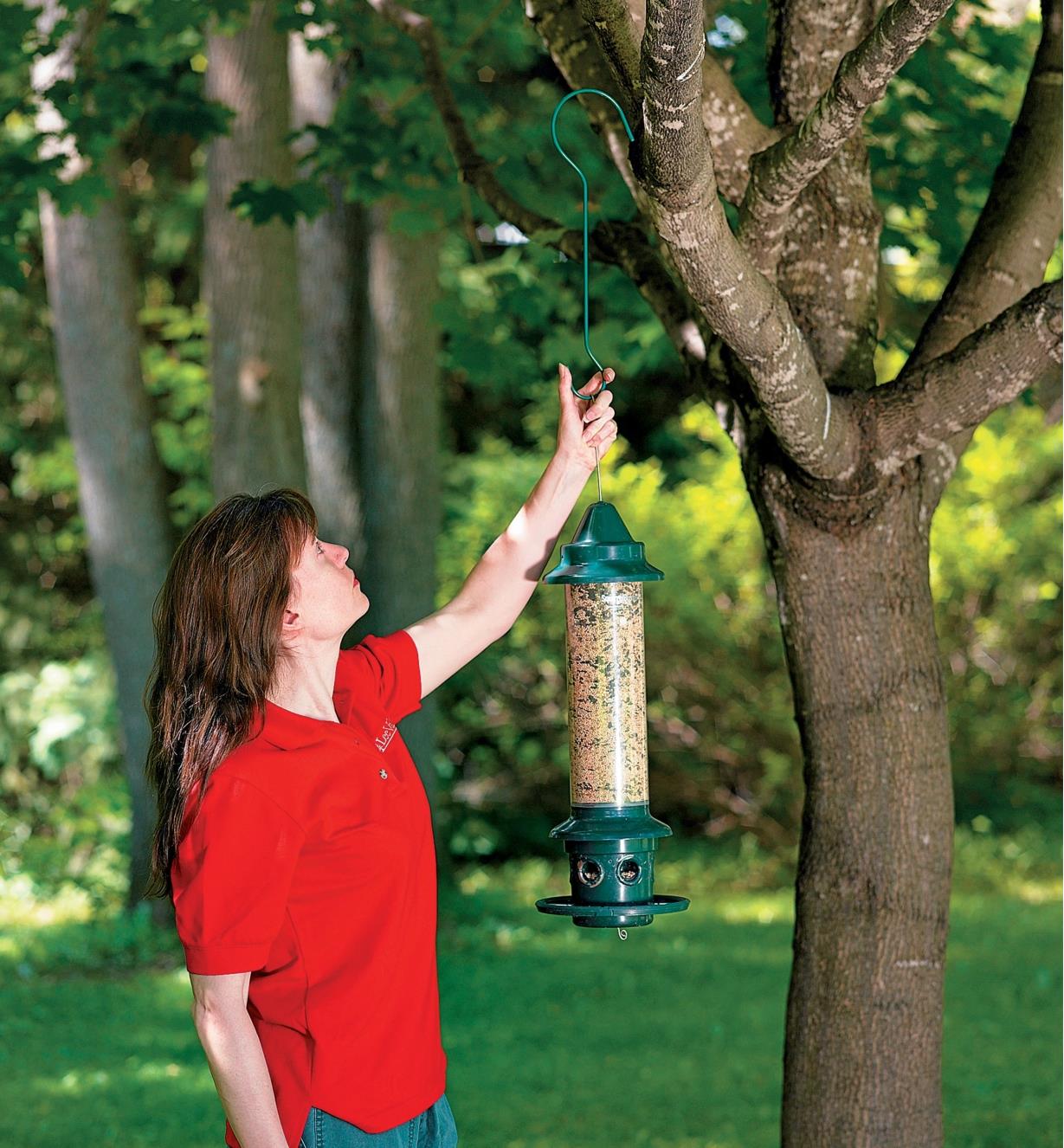 Hanging a Squirrel Buster Plus Feeder in a tree using a garden hook