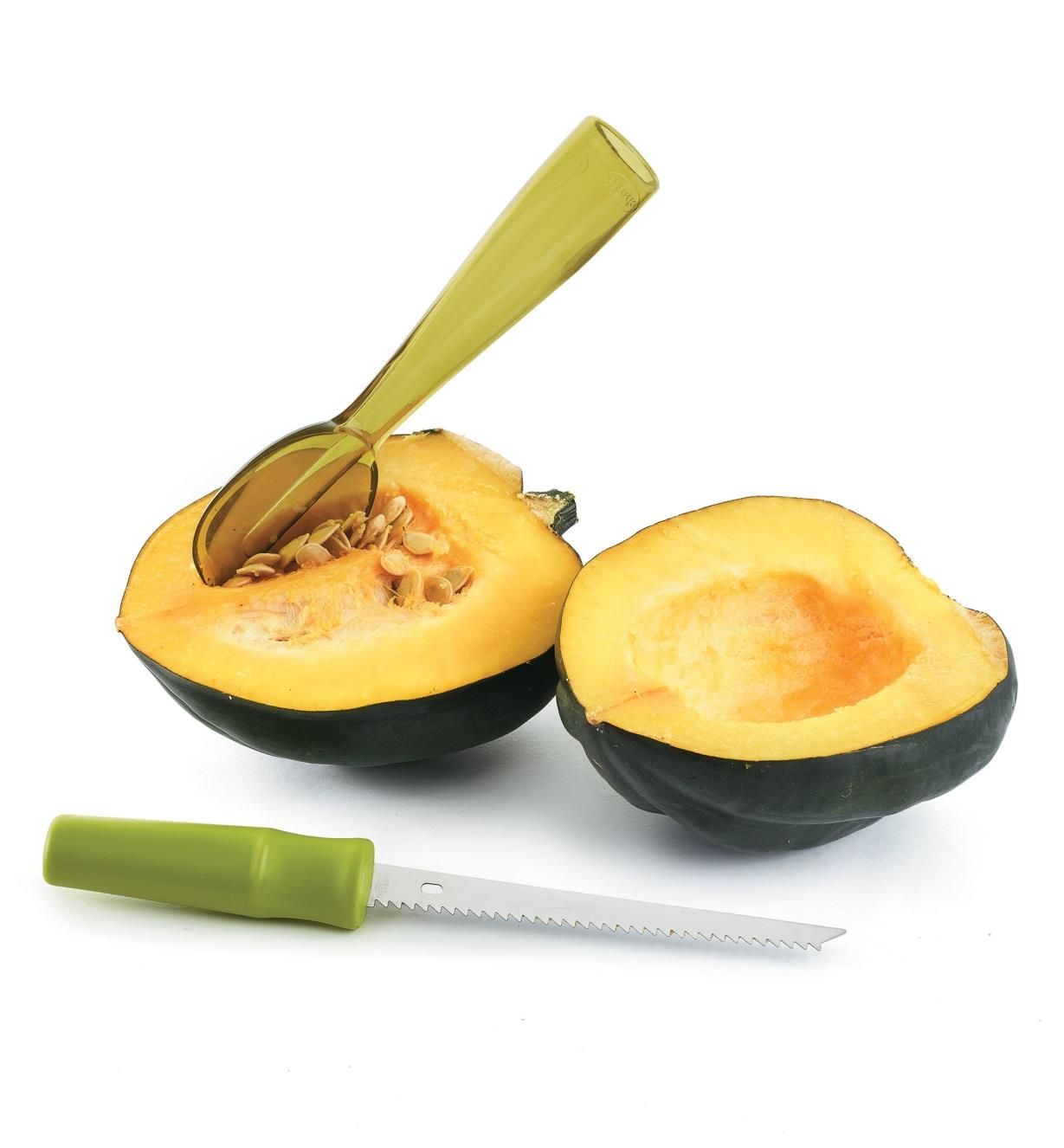 Scoop being used to remove seeds from a squash
