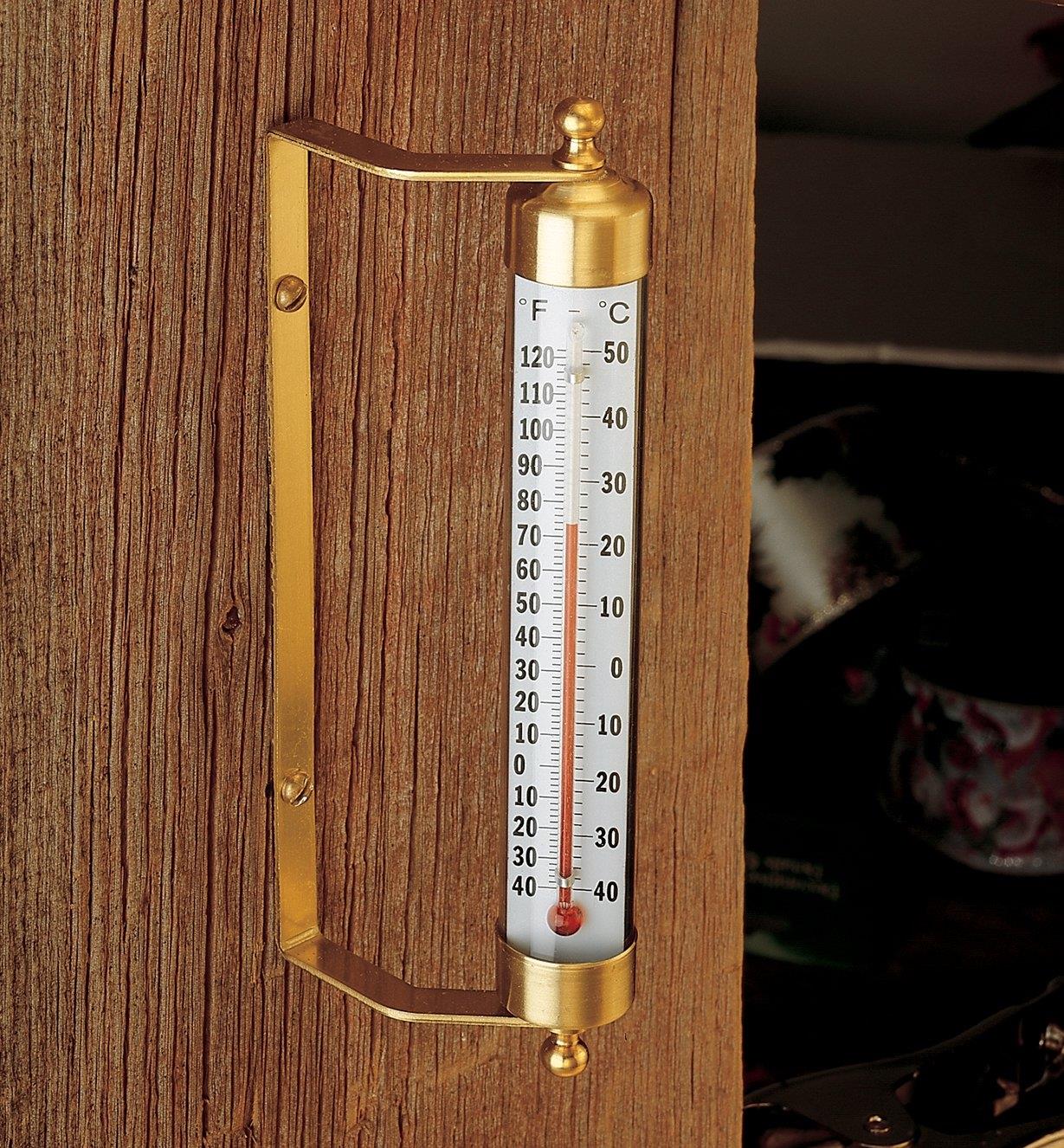 Solid Brass Thermometer mounted on a wall