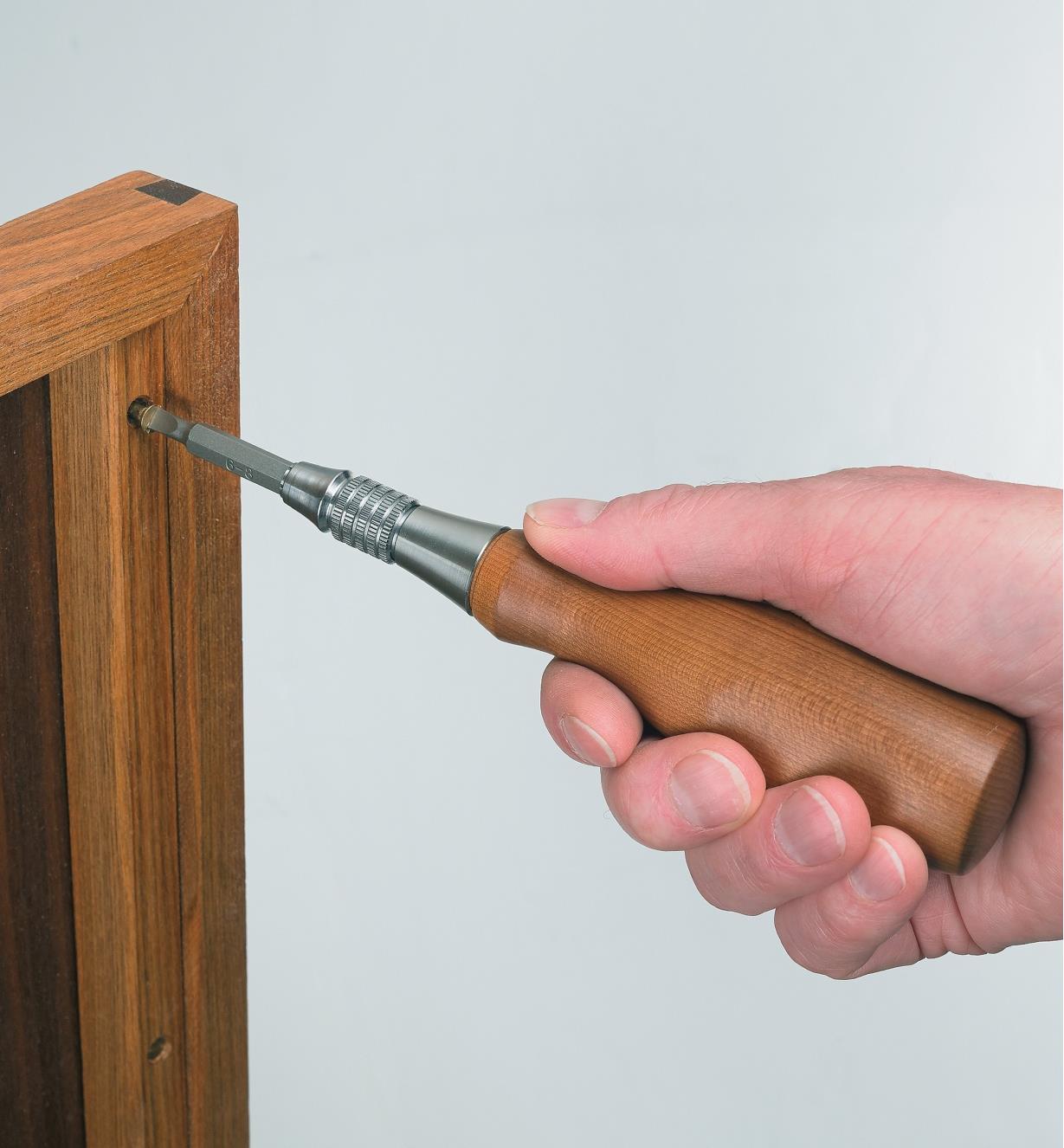 Installing a a screw with the screwdriver
