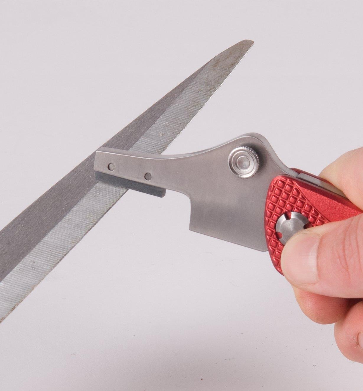 Universal Sharpener being used to sharpen scissors