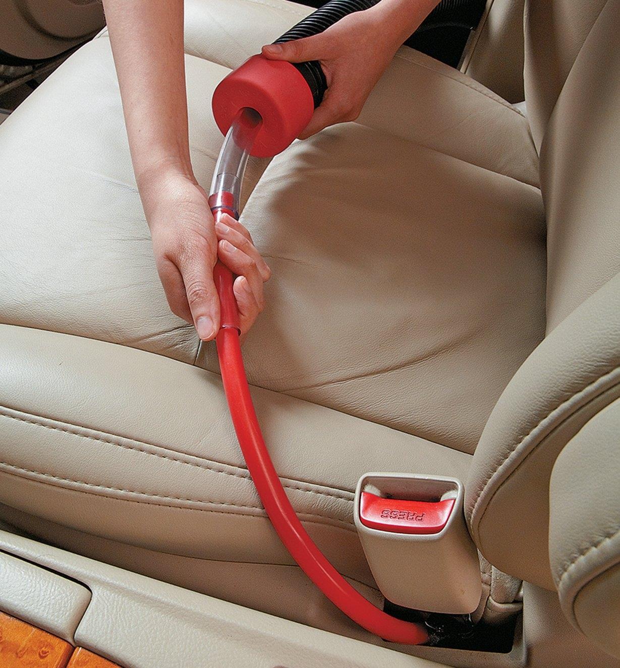 Vacuuming around car seats using Vaccuflex