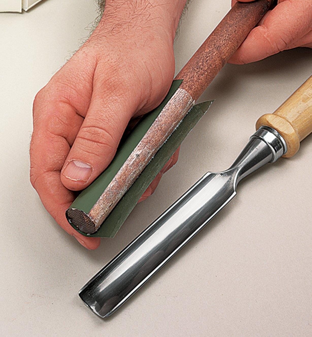 Micro-abrasive film being applied to a sharpening fid using transfer tape