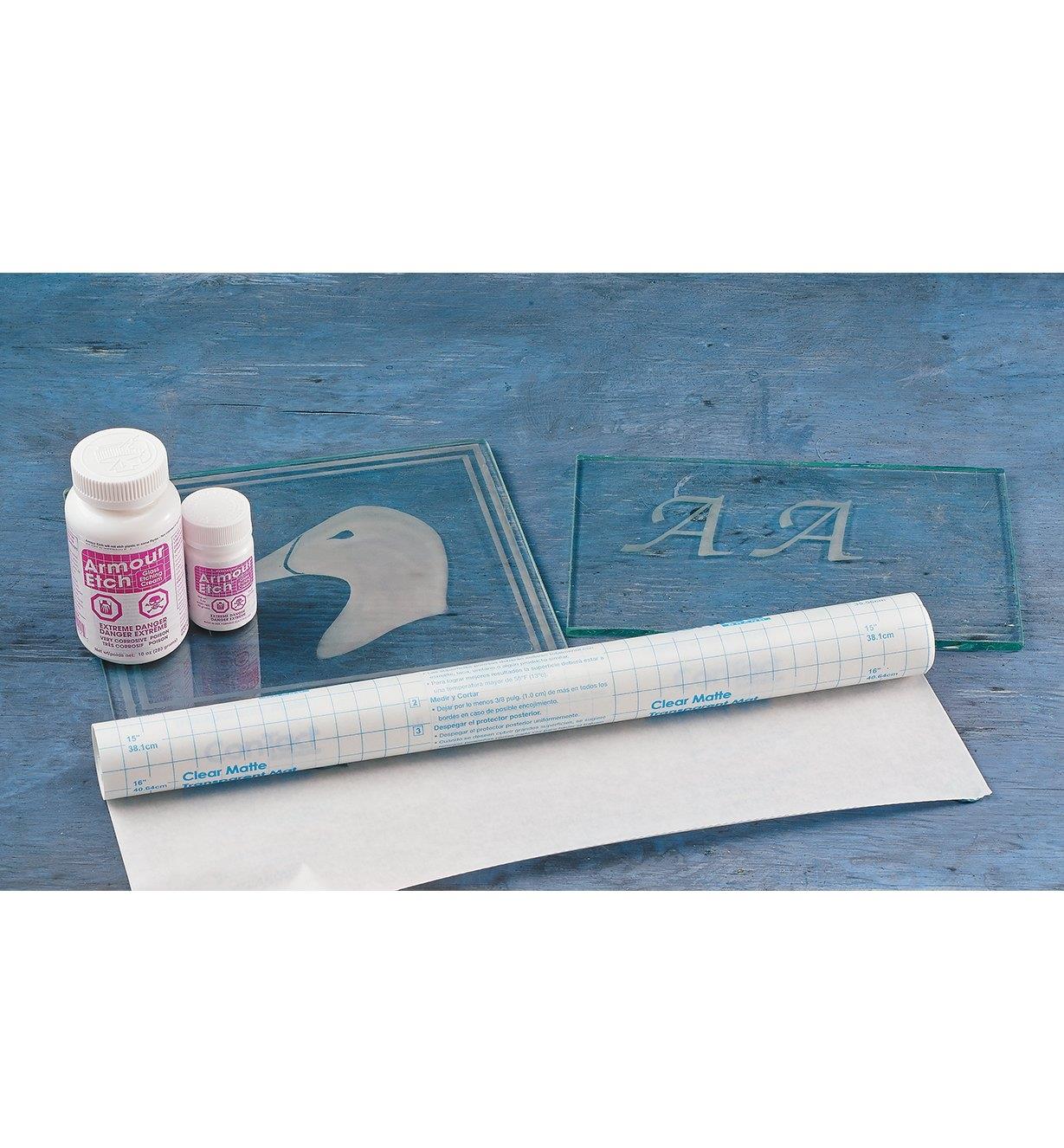Roll of Vinyl Masking with etching cream and two glass projects with etched designs