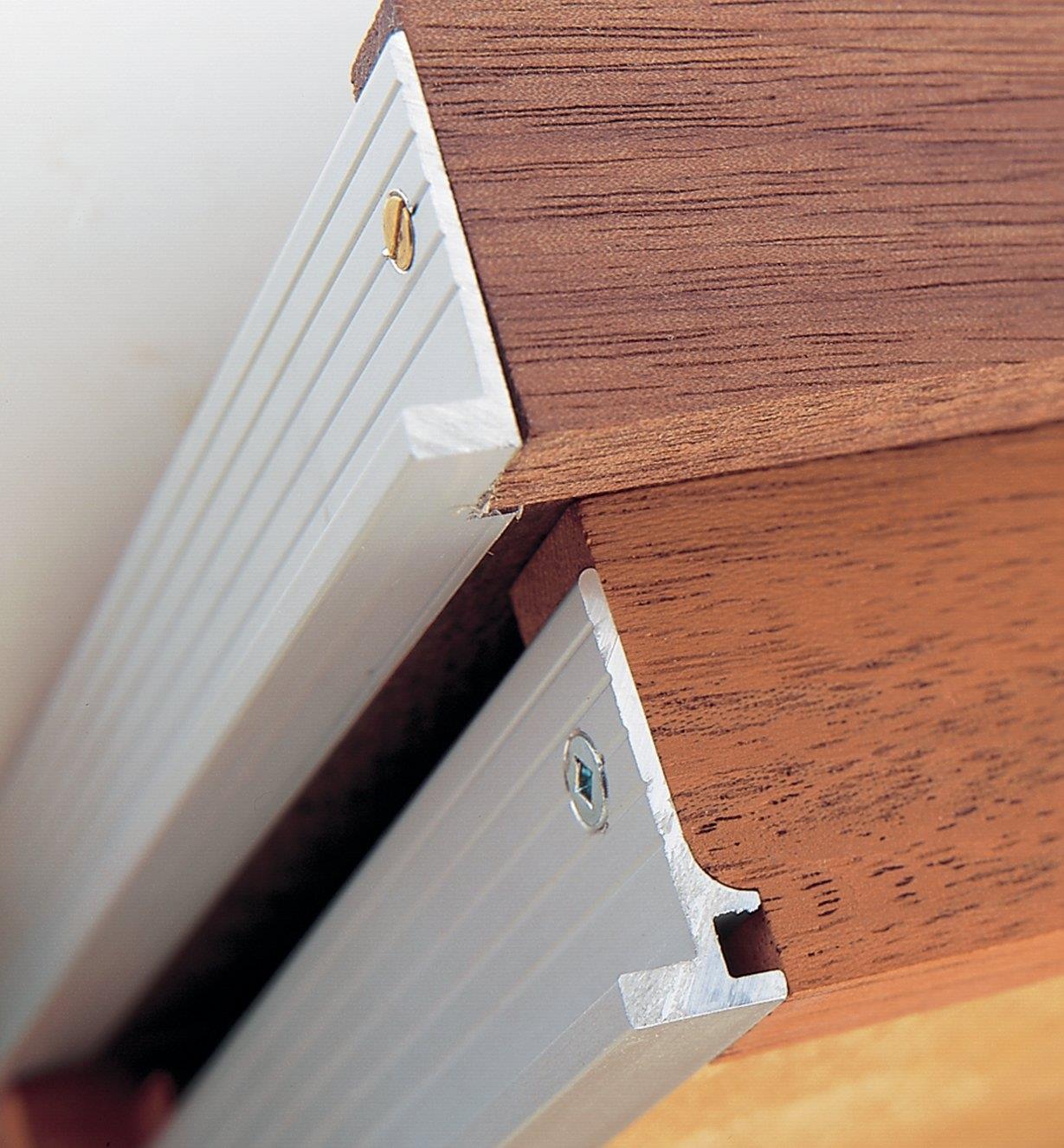 Close-ups of drawer backs made with Veritas Micro Drawer Slides/Sides shows notched method and routed method of construction