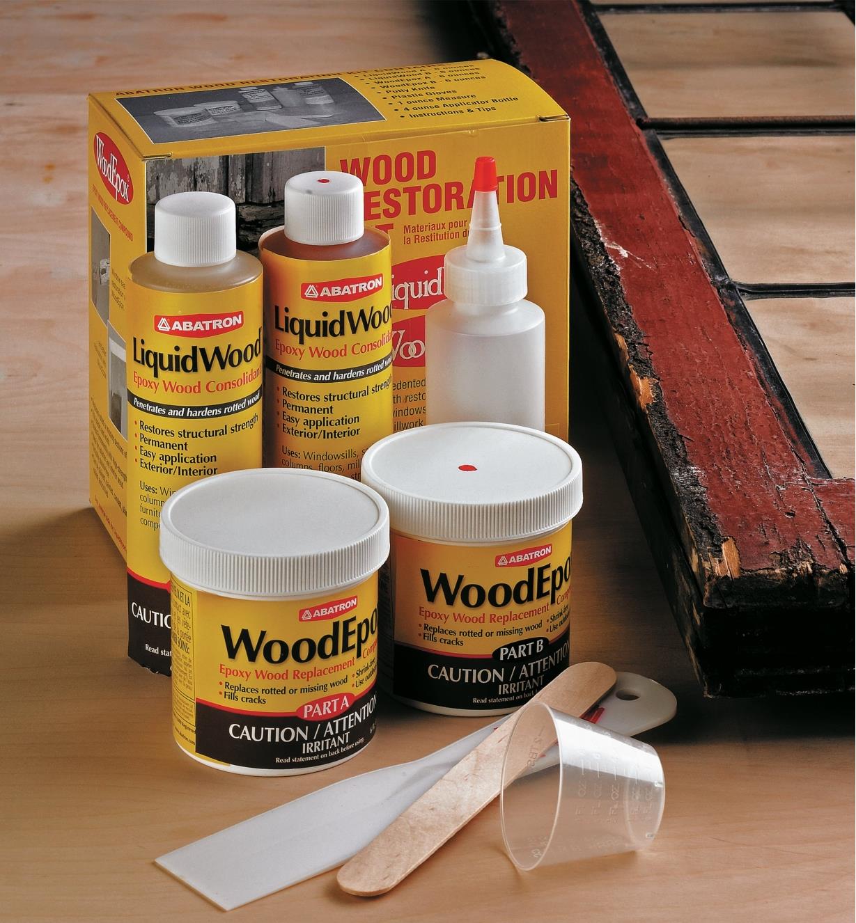 Wood Restoration Kit on a workbench next to a piece of old wood