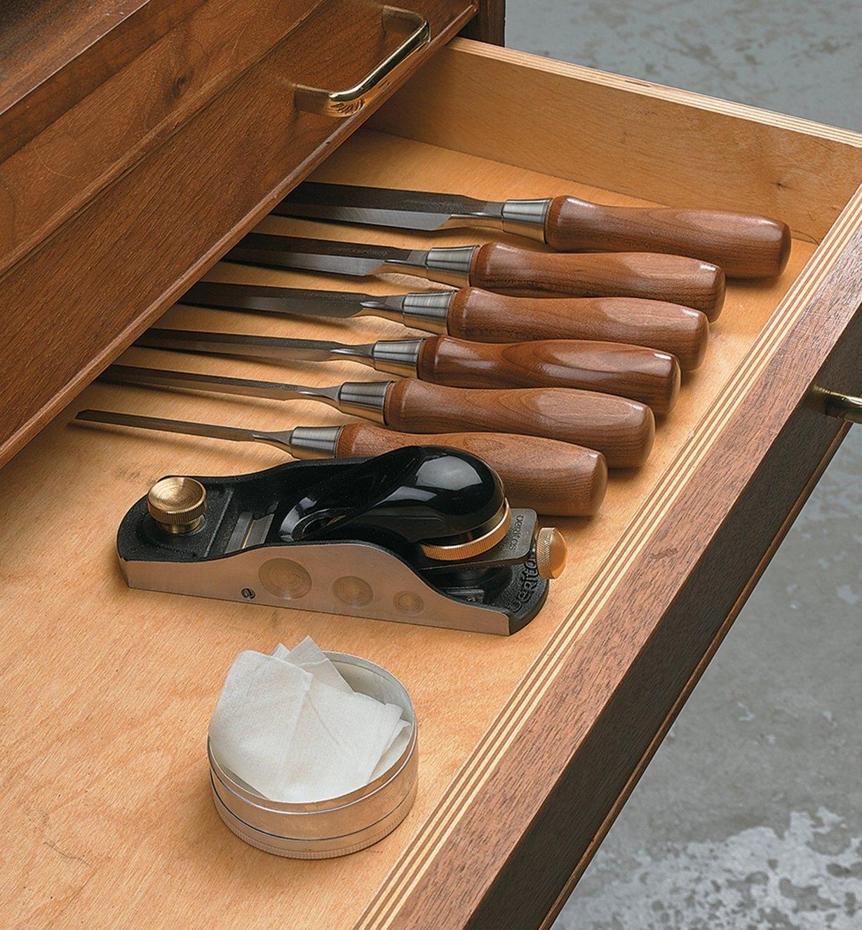 A VpCI Tool Wipe placed in a tool drawer with a plane and chisels