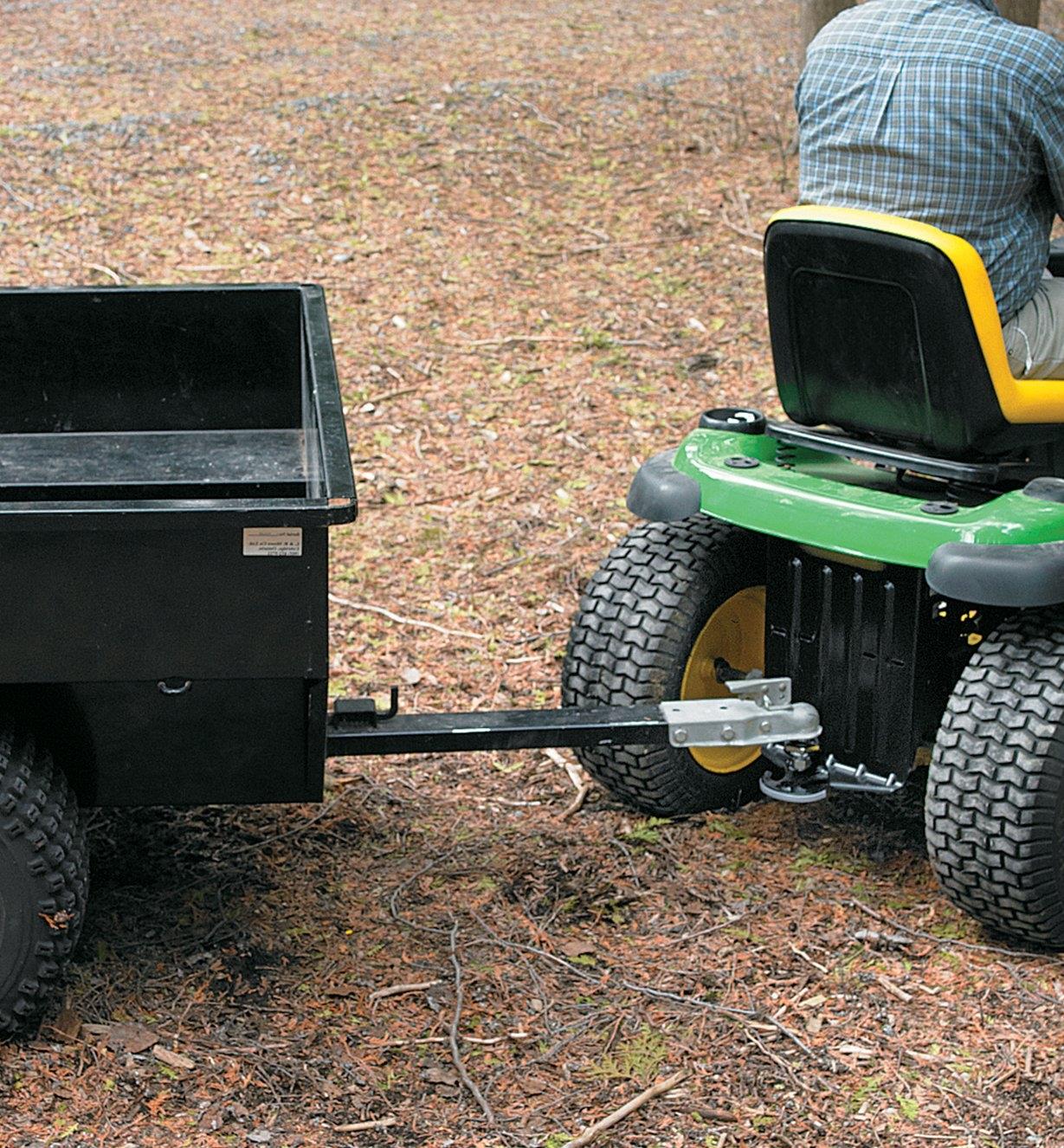 Universal Hitch Plate installed on a riding tractor that is pulling a wagon