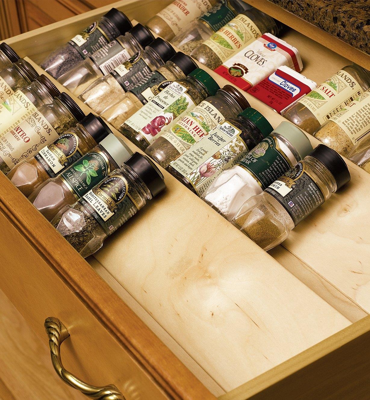 Wooden Spice Drawer Inserts holding spice jars in a drawer