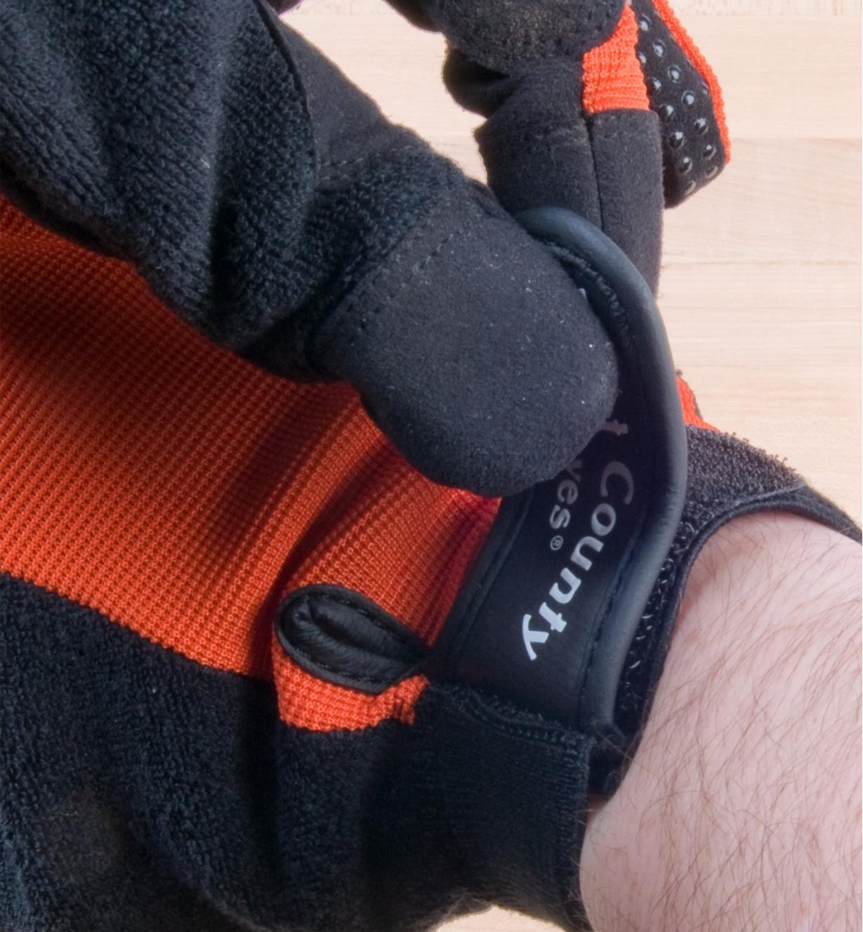 Adjusting the cuff on a work glove